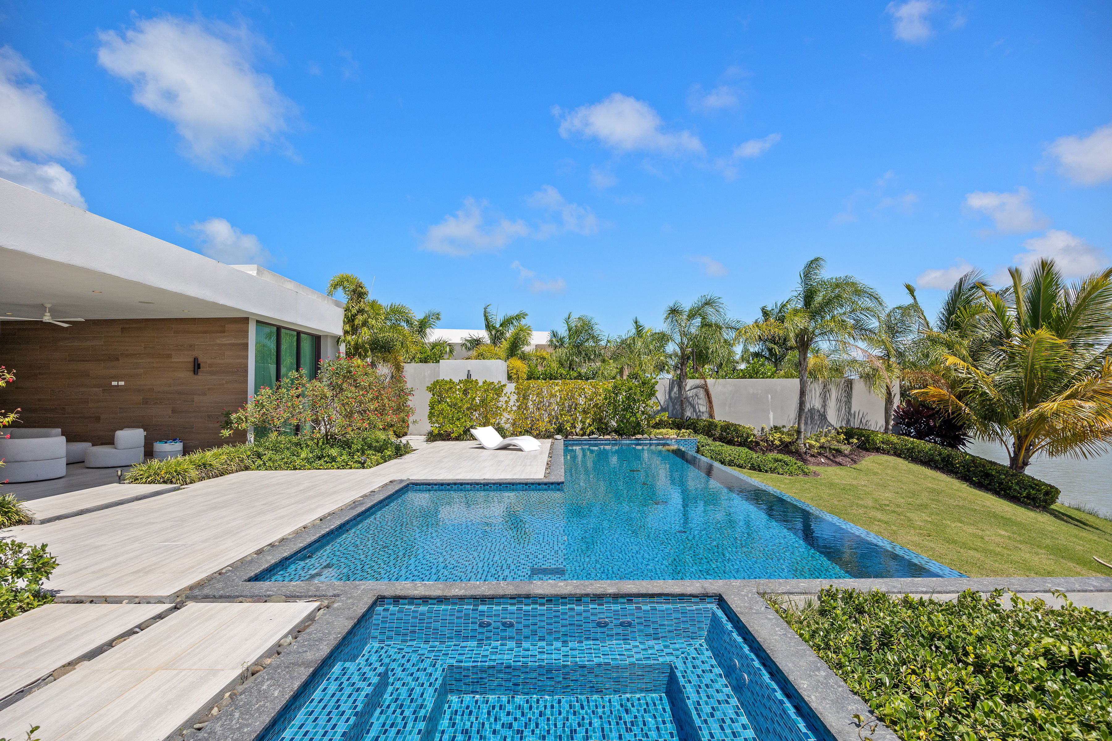 Dorado Beach Resort The Isles residence infinity pool and jacuzzi with landscaped garden and lake views