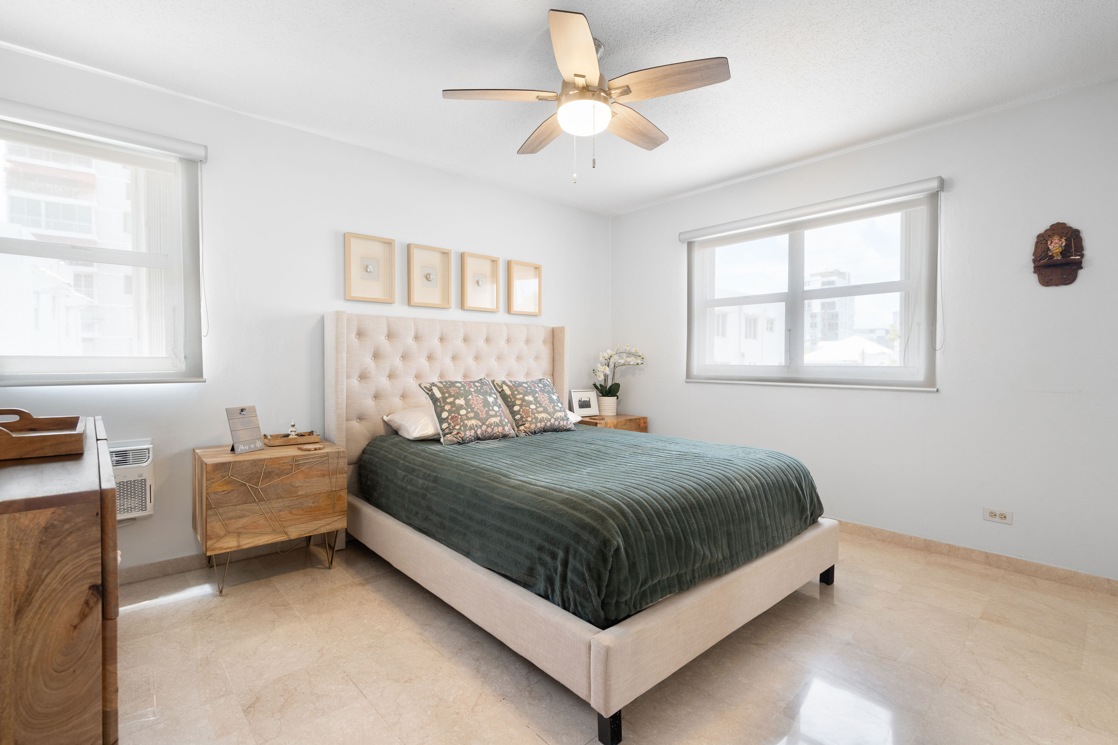 Kings Court 81 Condado | Primary bedroom with natural light, city views, and a serene atmosphere