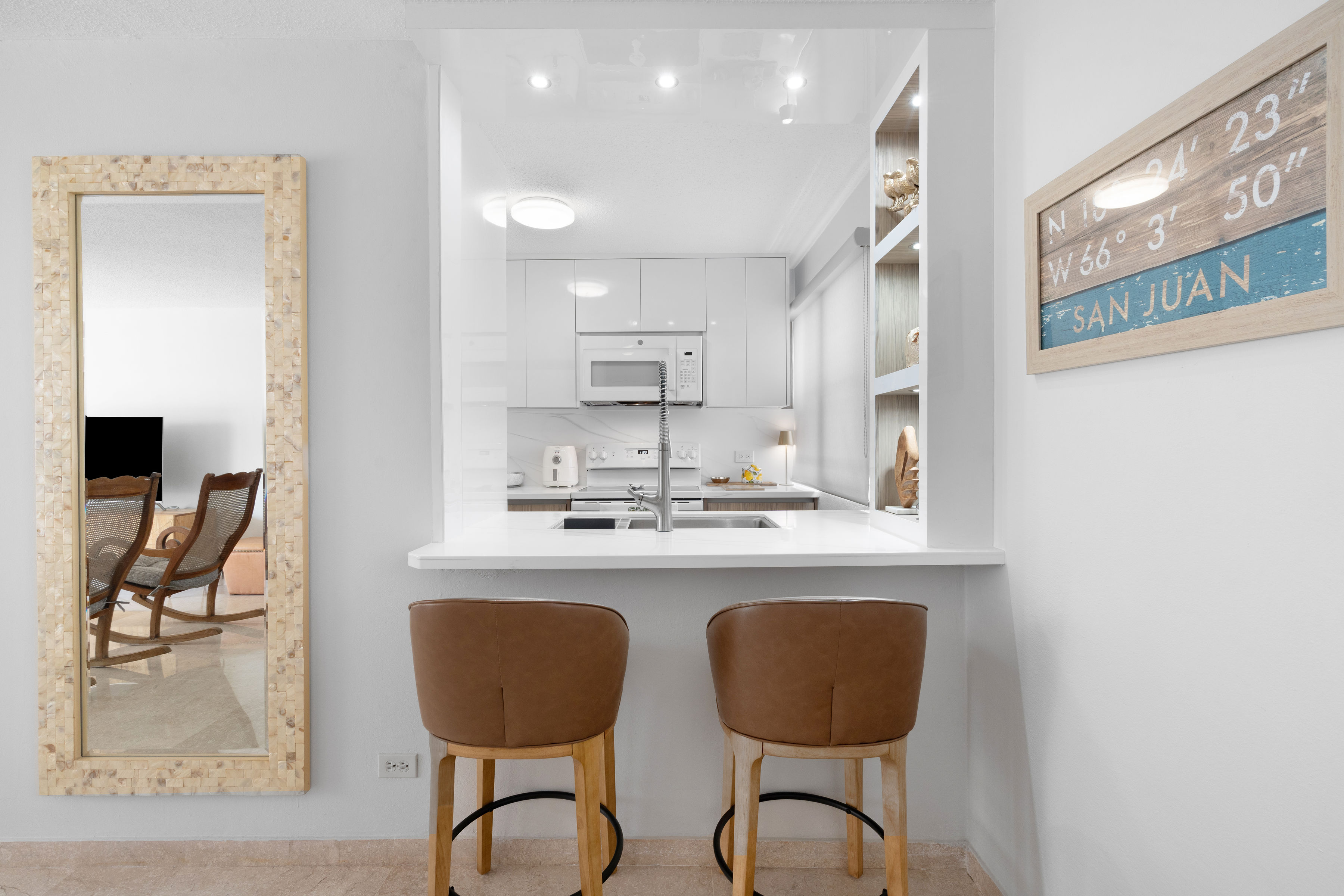 Kings Court 81 Condado | Renovated kitchen with breakfast bar seating and contemporary finishes