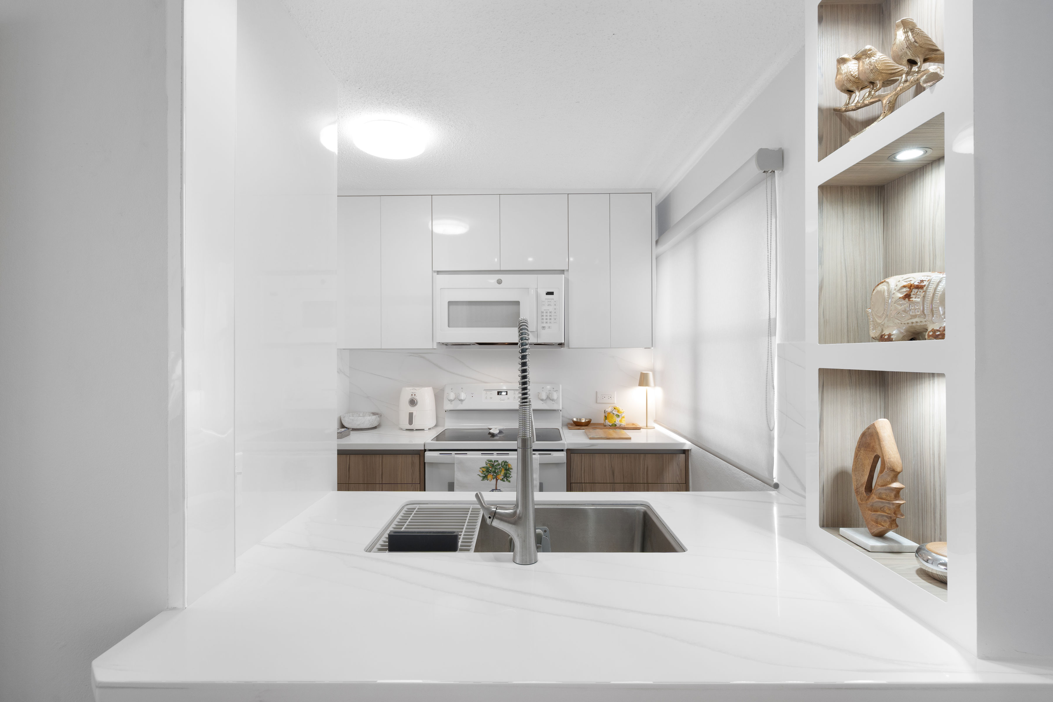 Kings Court 81 Condado | Modern kitchen with integrated laundry area and efficient layout