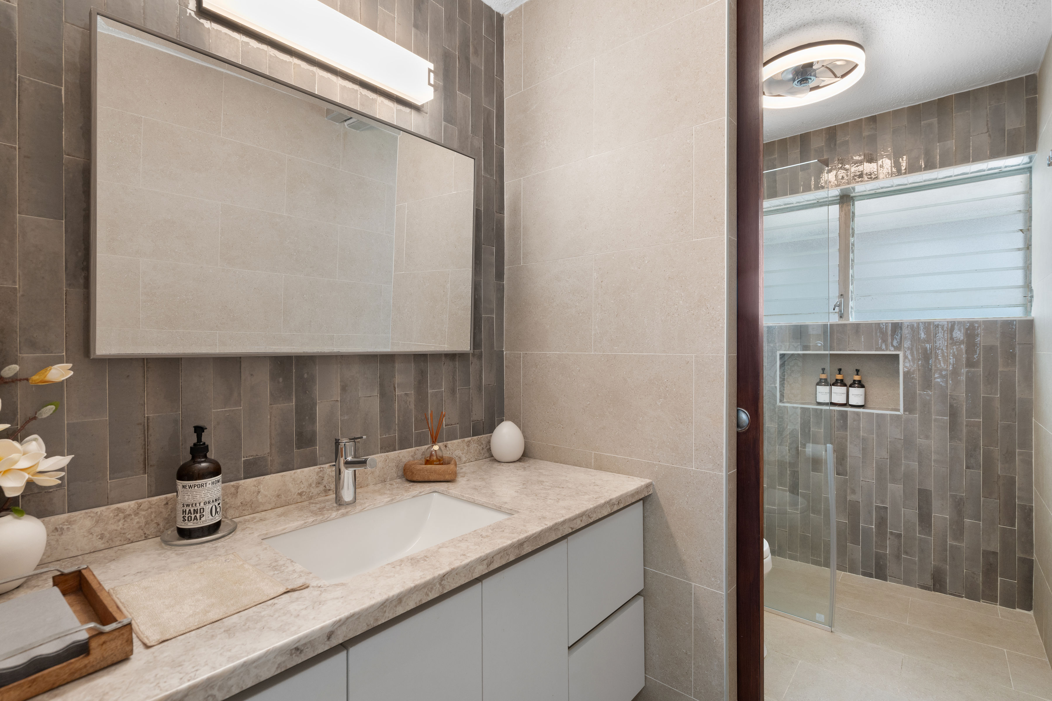 Kings Court 81 Condado | Fully renovated bathroom with walk-in shower, custom vanity, and contemporary finishes