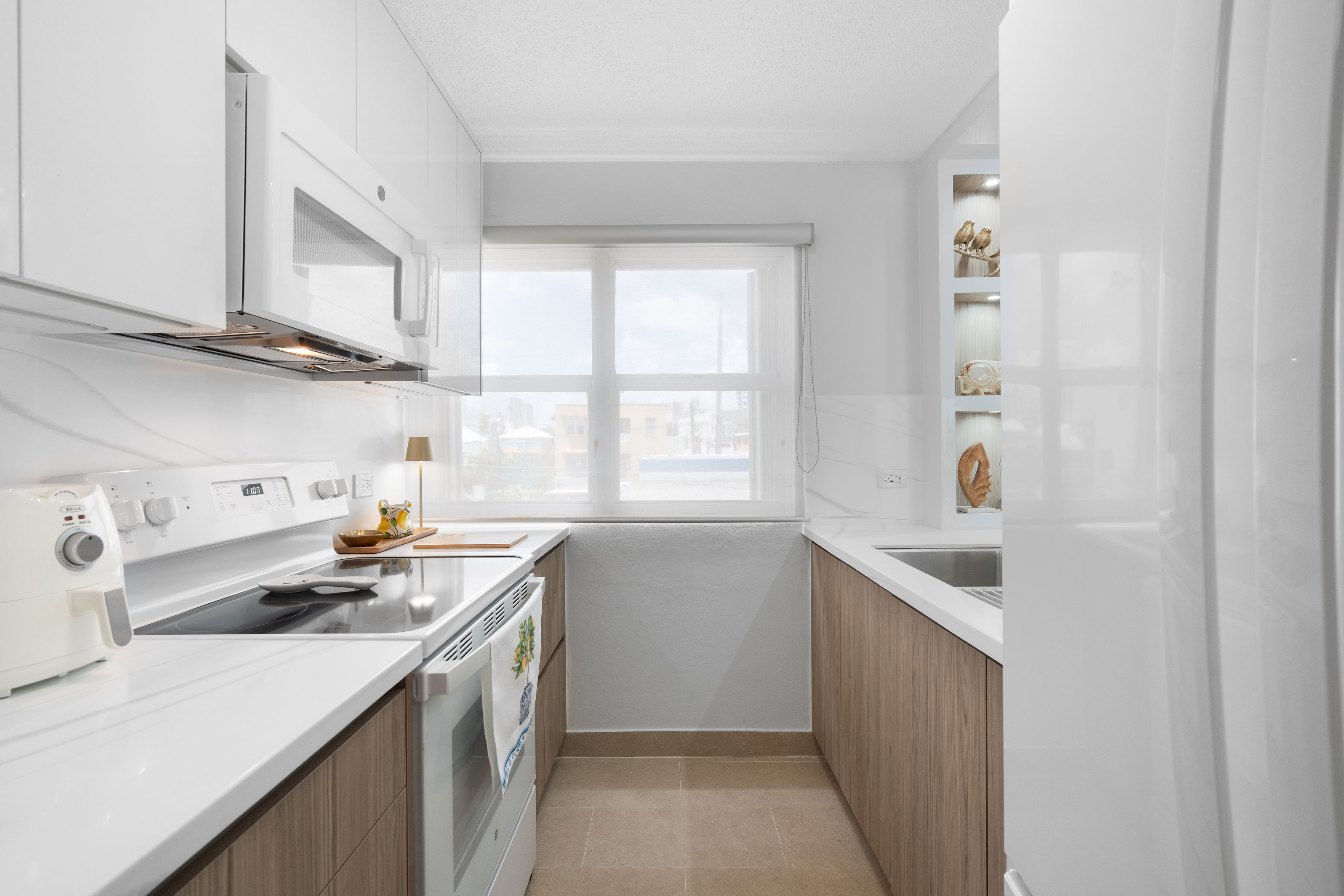 Kings Court 81 Condado | Renovated kitchen with updated appliances and custom cabinetry