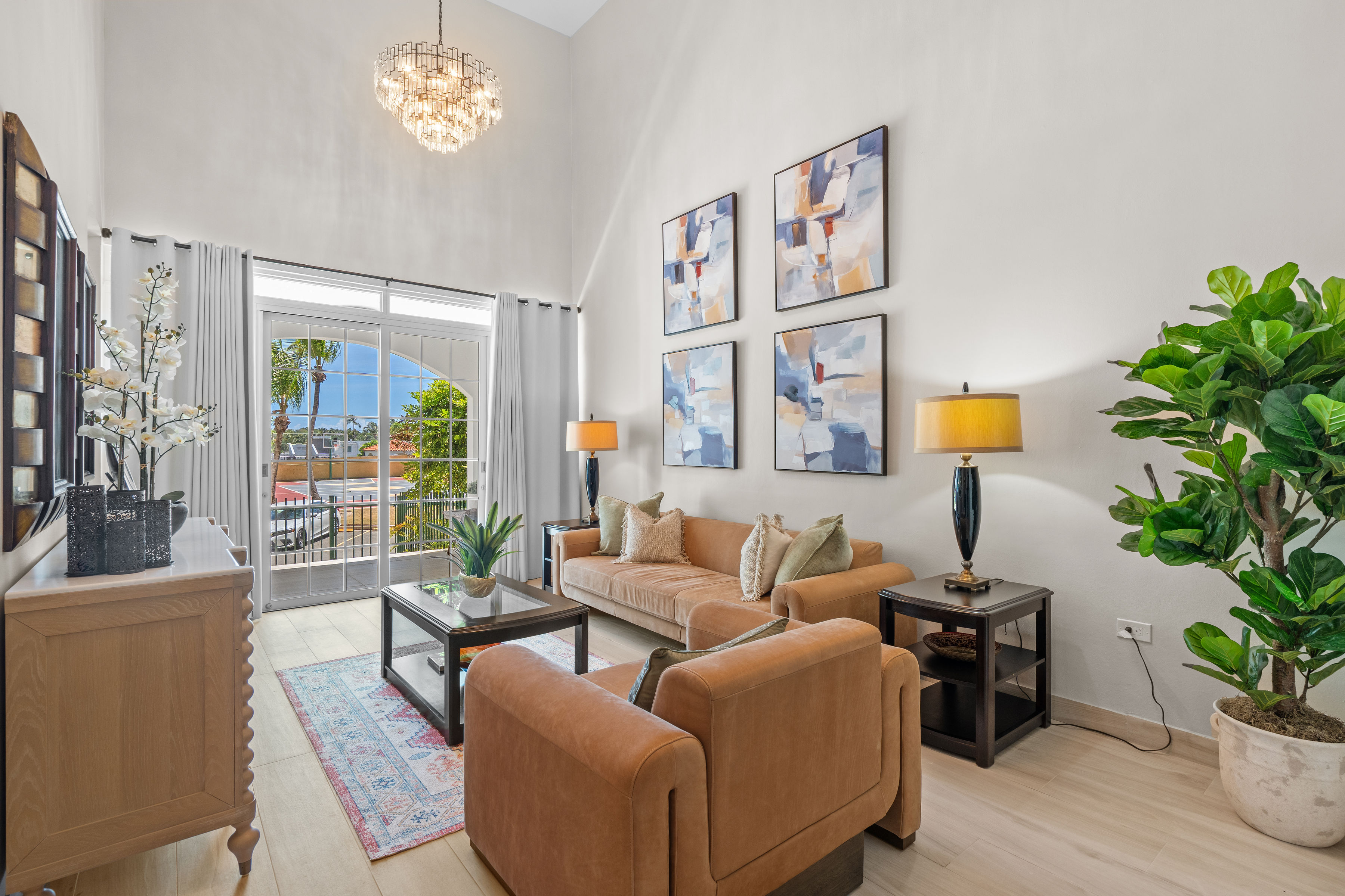 Royal Palm Vega Alta | Double-height living room with balcony access and open-concept design