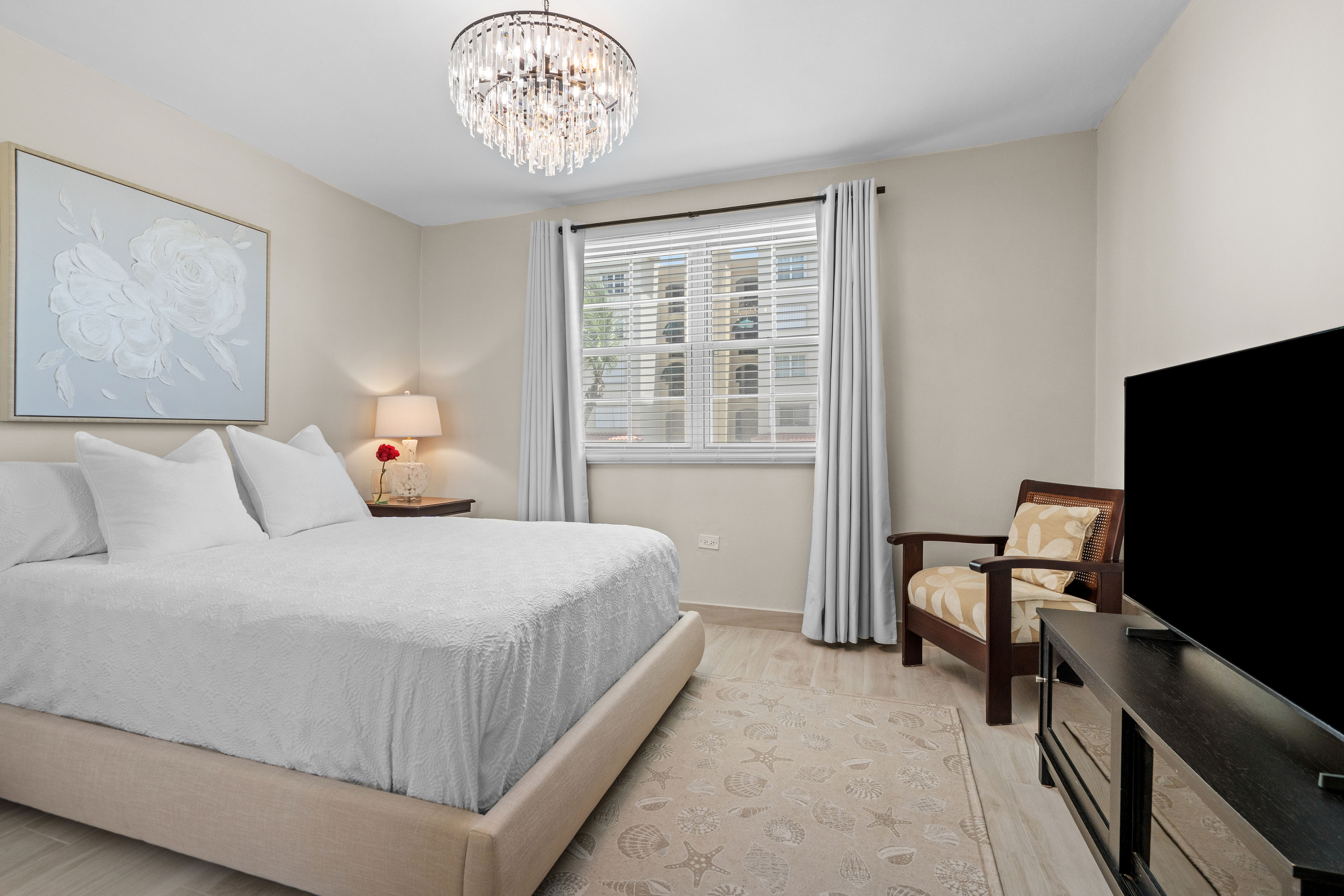 Royal Palm Vega Alta | Guest bedroom with elegant finishes, designer lighting, and ample natural light