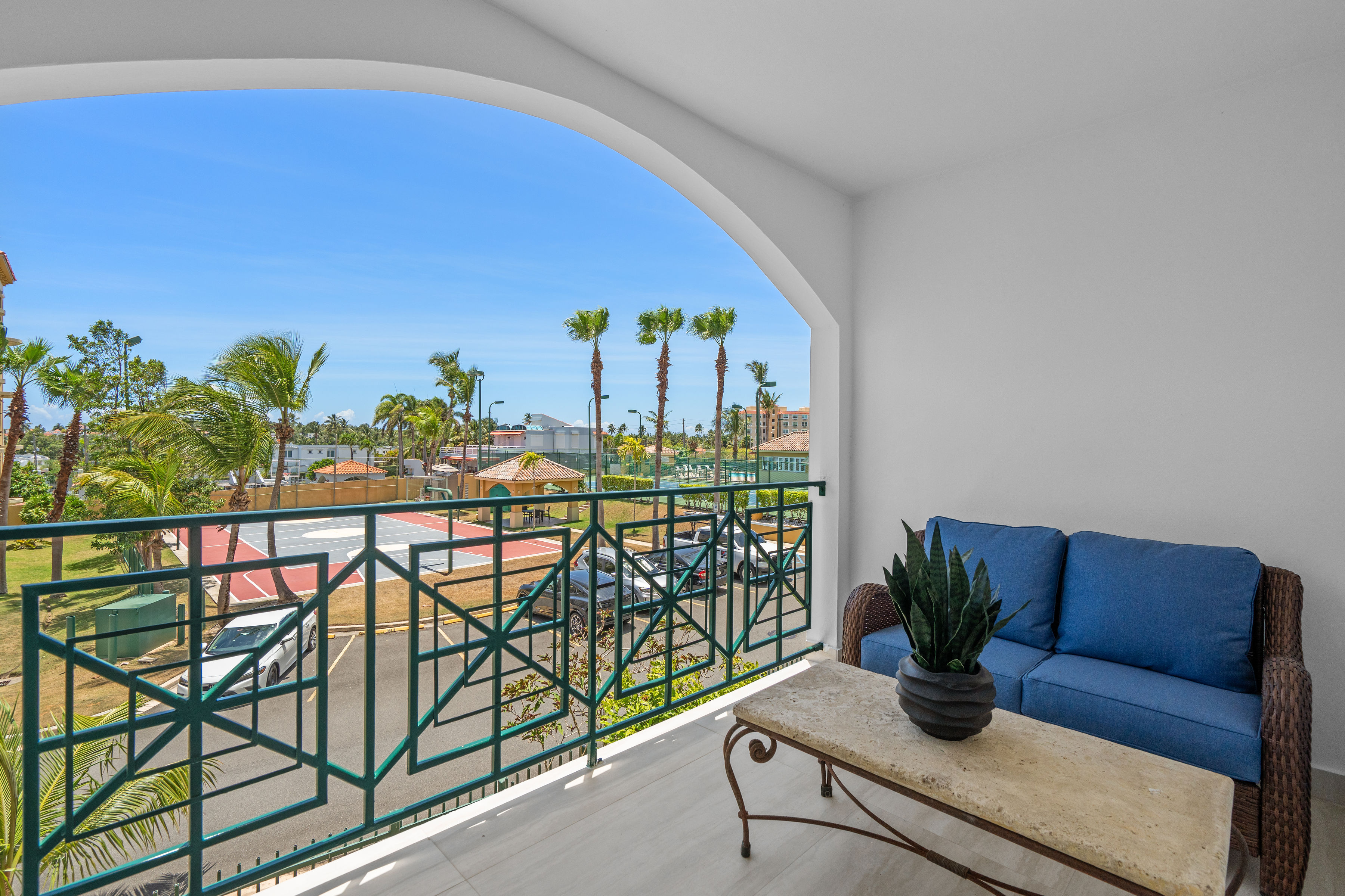 Royal Palm Vega Alta | Private sitting room with balcony access and views of Royal Palm amenities