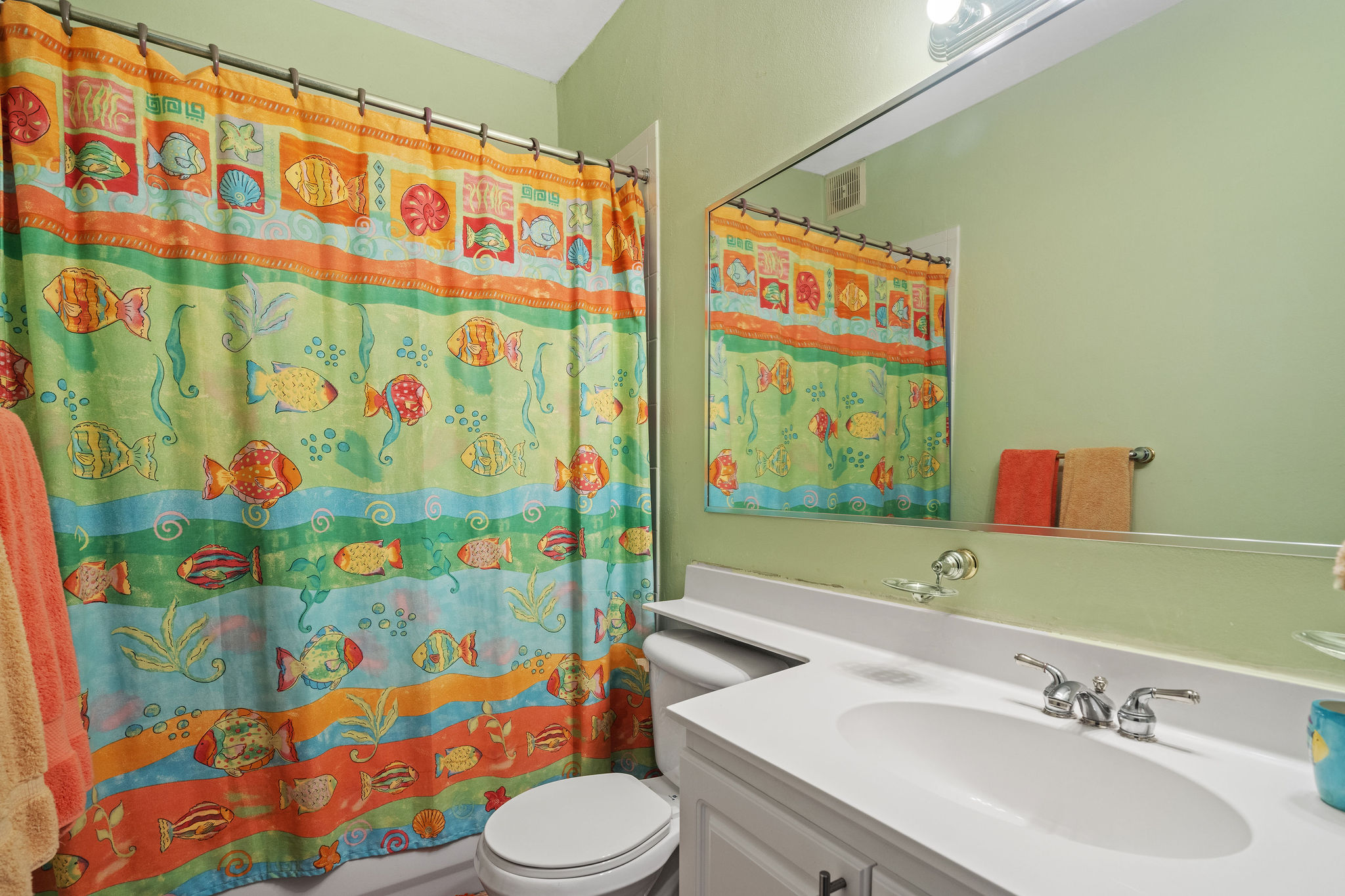 Royal Palm secondary bathroom with bathtub and vanity