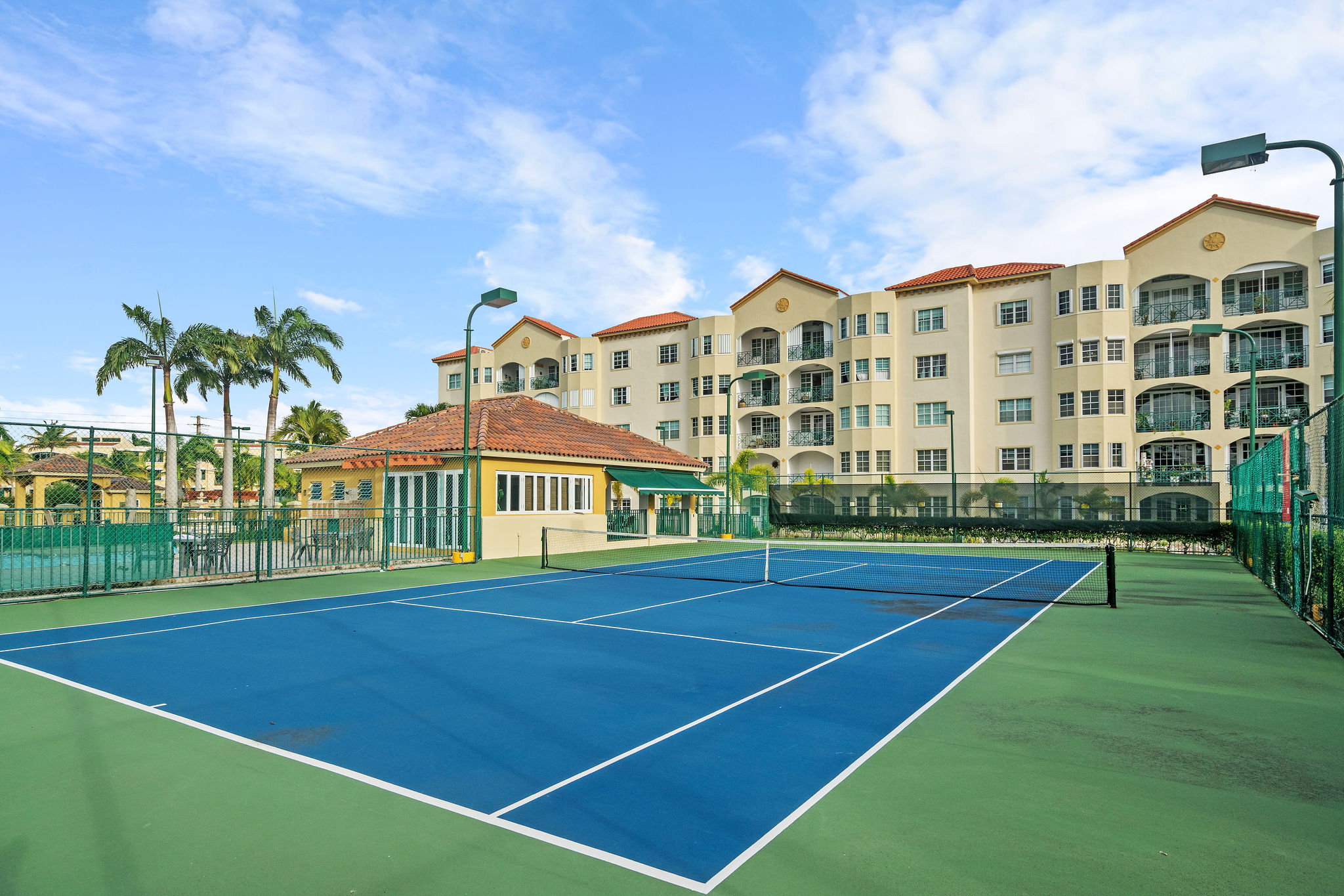 Royal Palm community tennis court and residential surroundings