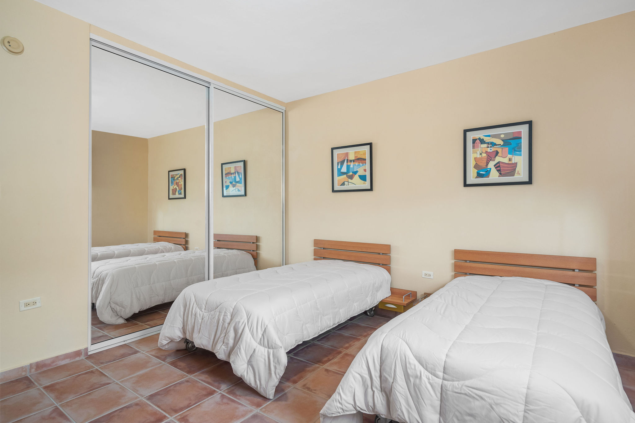 Royal Palm secondary bedroom with two beds and mirrored closet