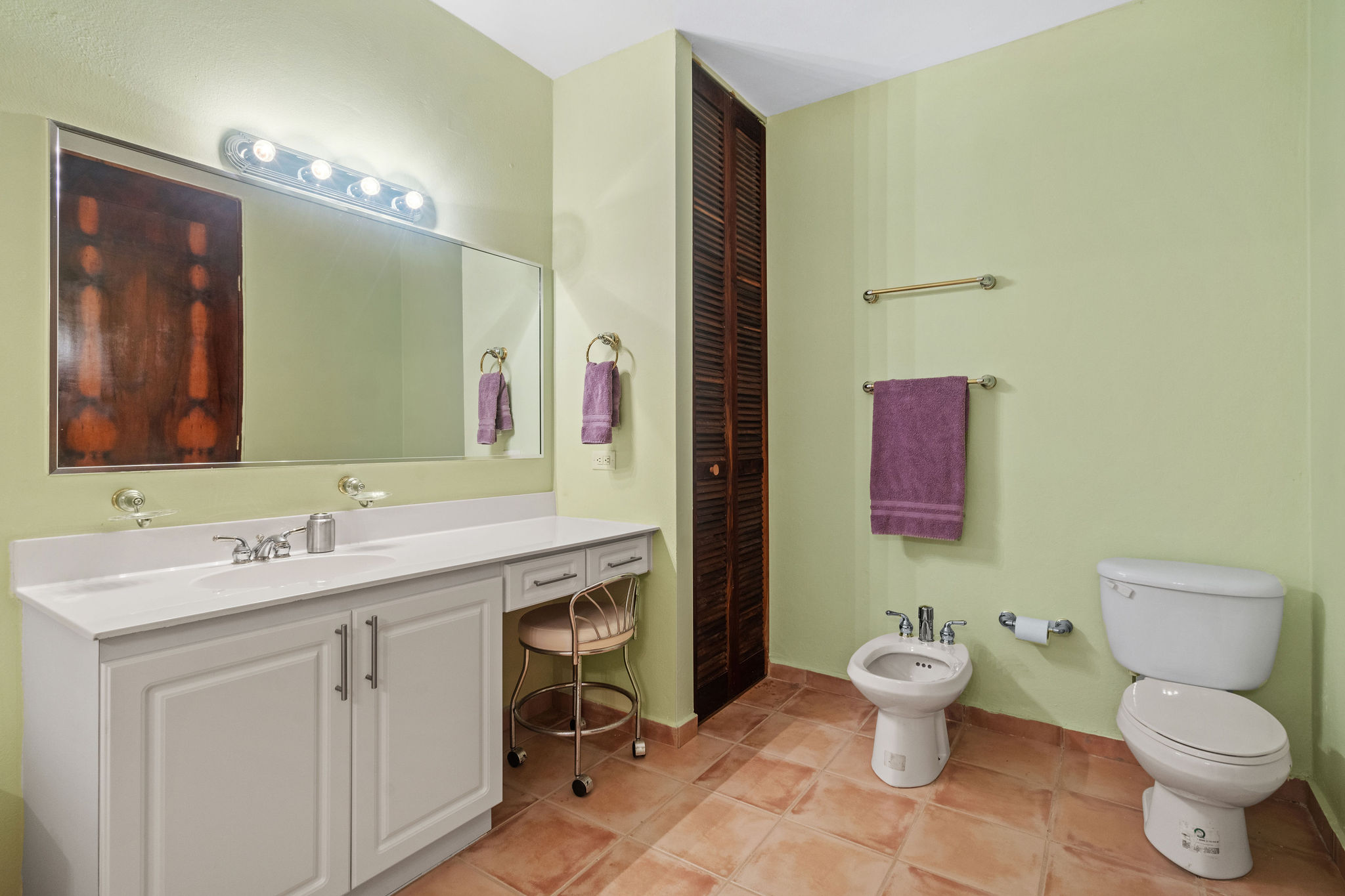 Royal Palm primary bathroom with spacious vanity and bathtub
