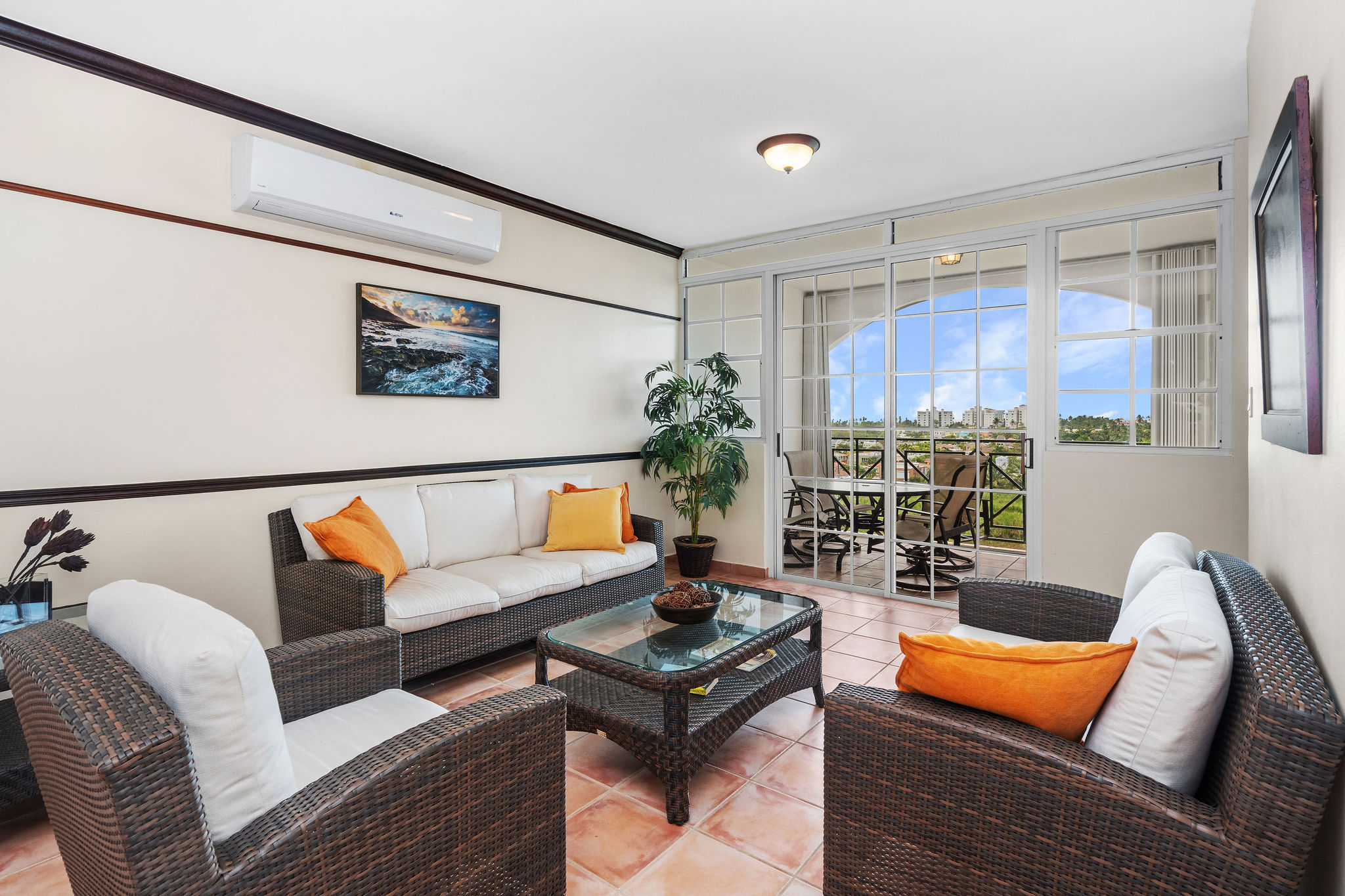 Royal Palm family room with comfortable seating and large windows