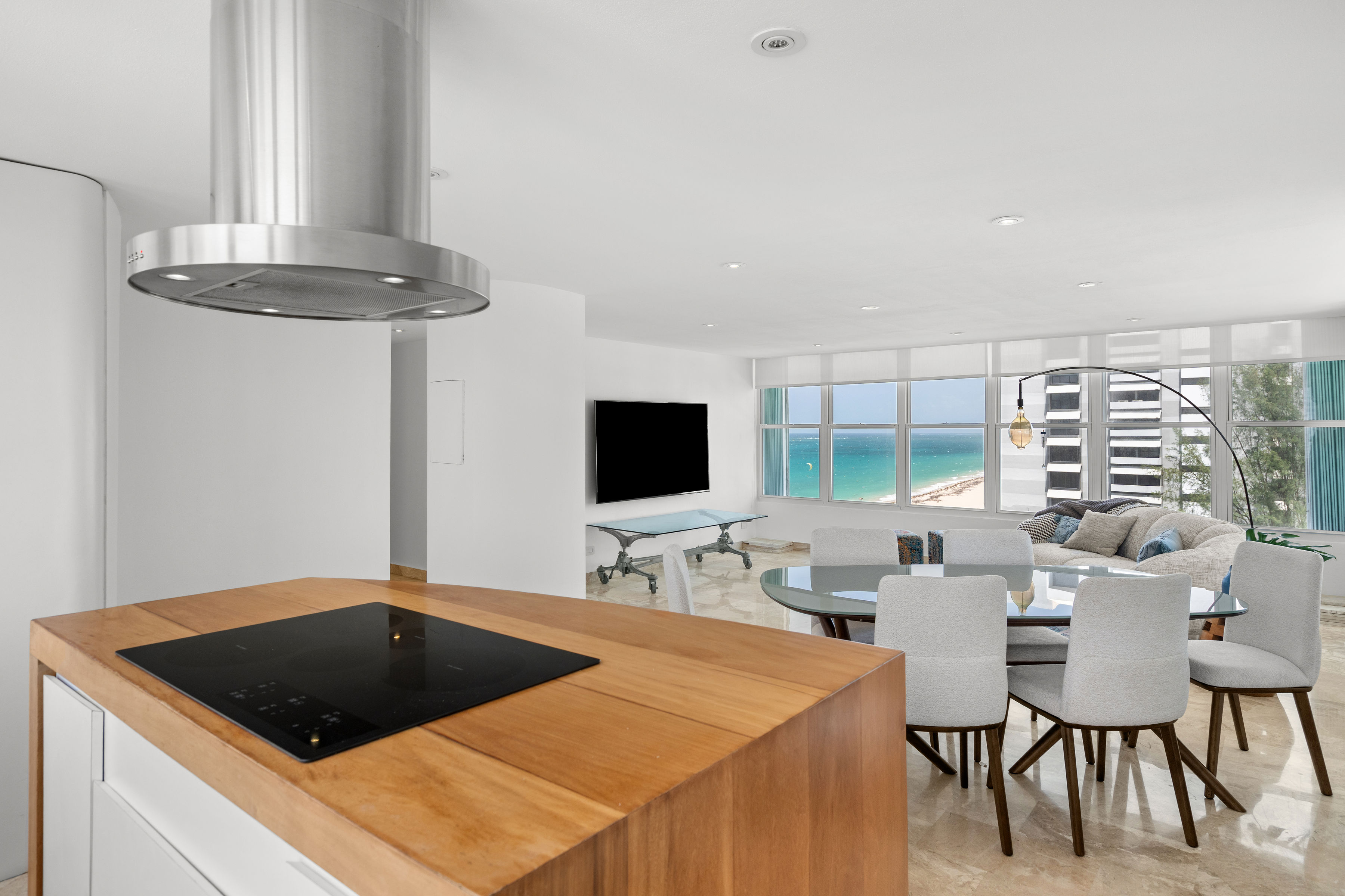 Las Olas Condado open kitchen overlooking the dining and living areas