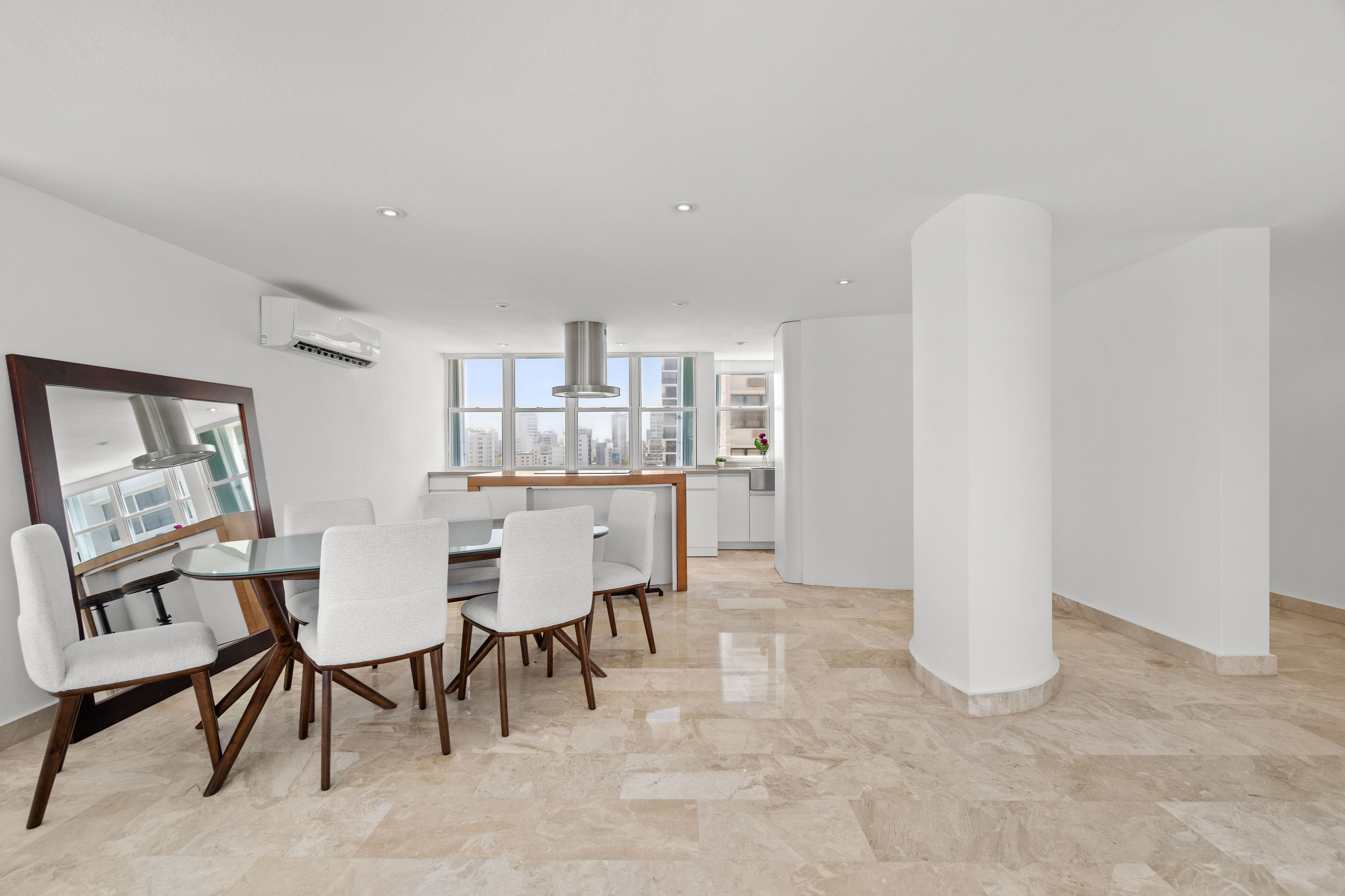 Las Olas Condado dining area with modern furnishings and city views