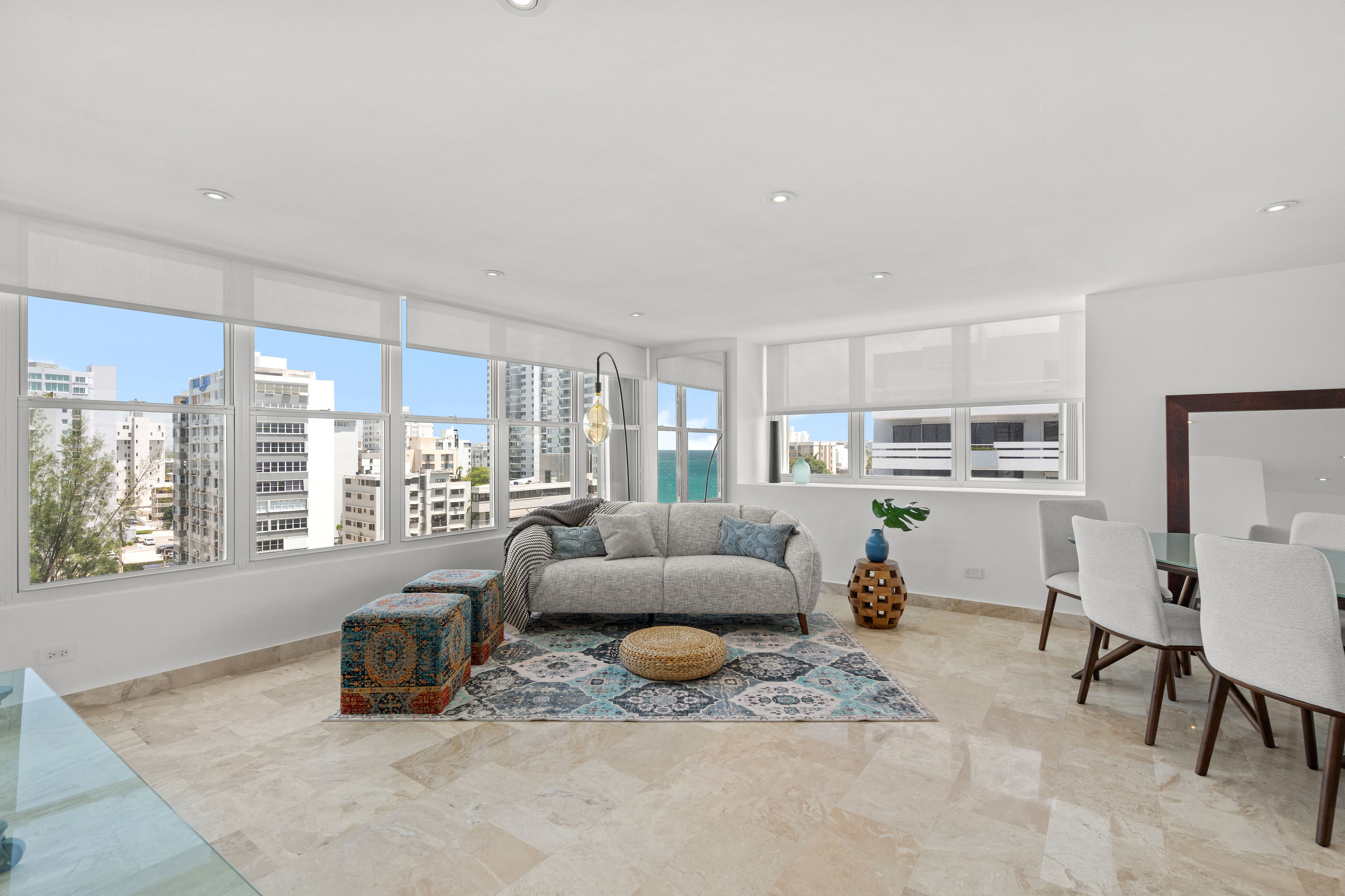 Las Olas Condado open living and dining area with floor-to-ceiling windows
