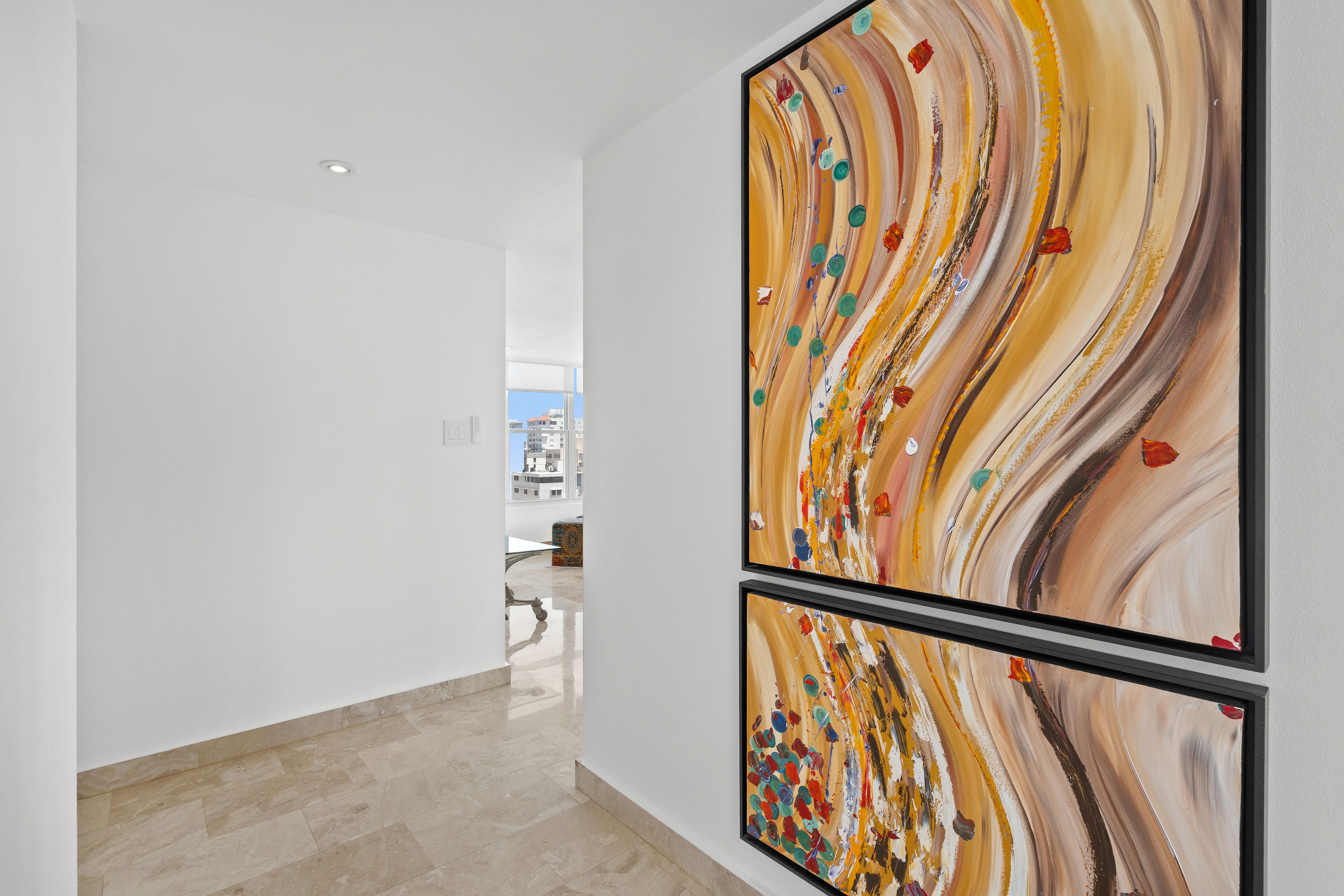 Las Olas Condado residence entry with colorful contemporary artwork