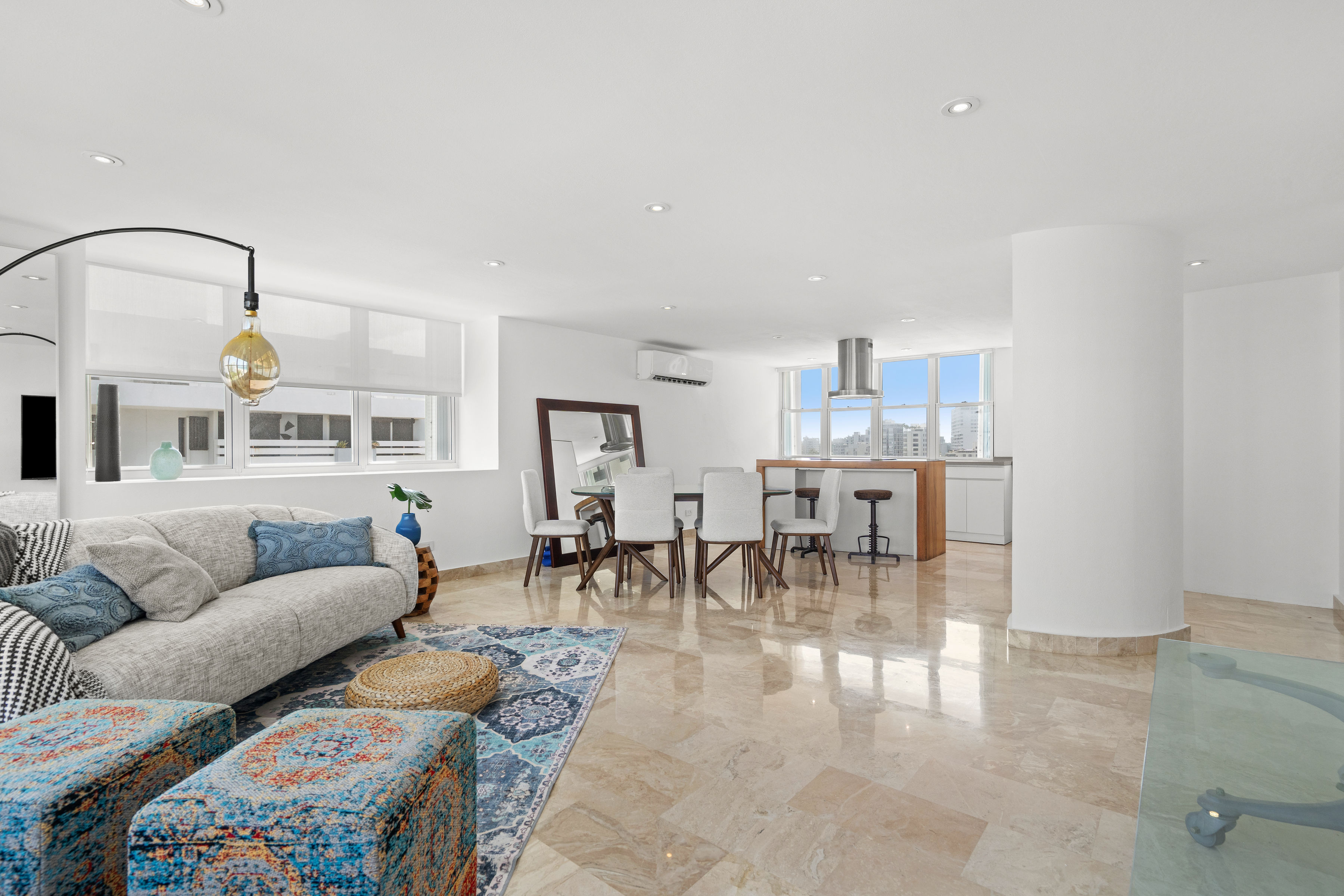 Las Olas Condado open-concept living and dining area with contemporary furnishings
