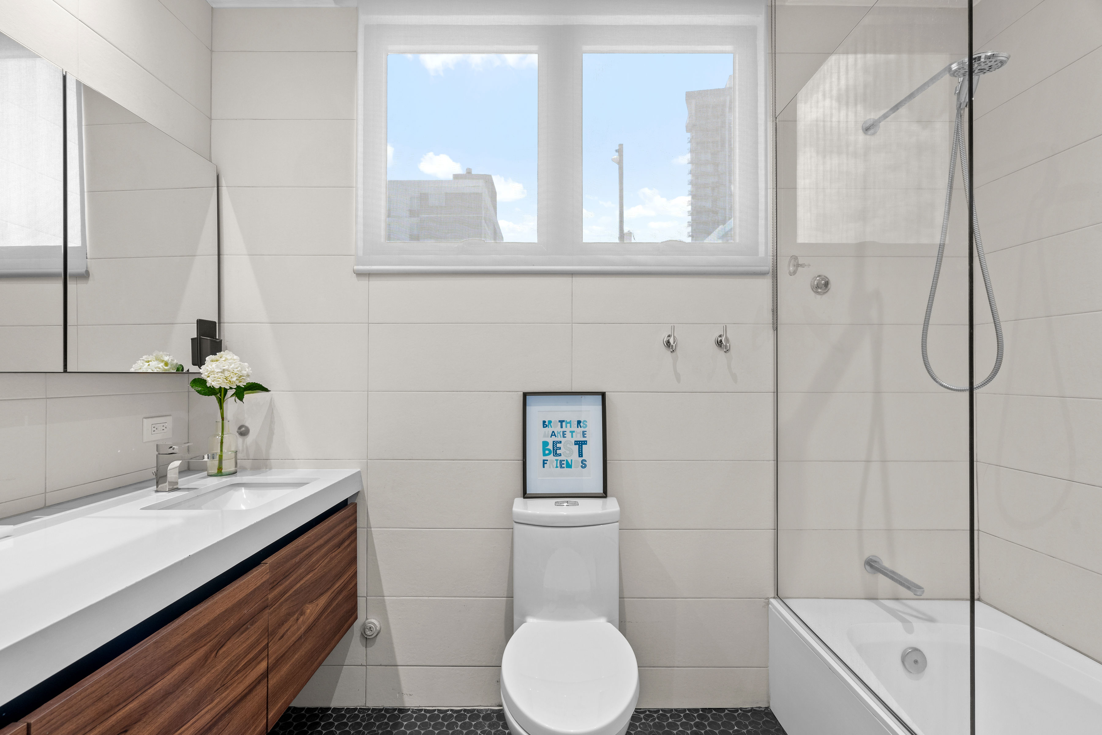 Casa Cervantes 2 | Contemporary bathroom with bathtub, glass shower enclosure, and natural light