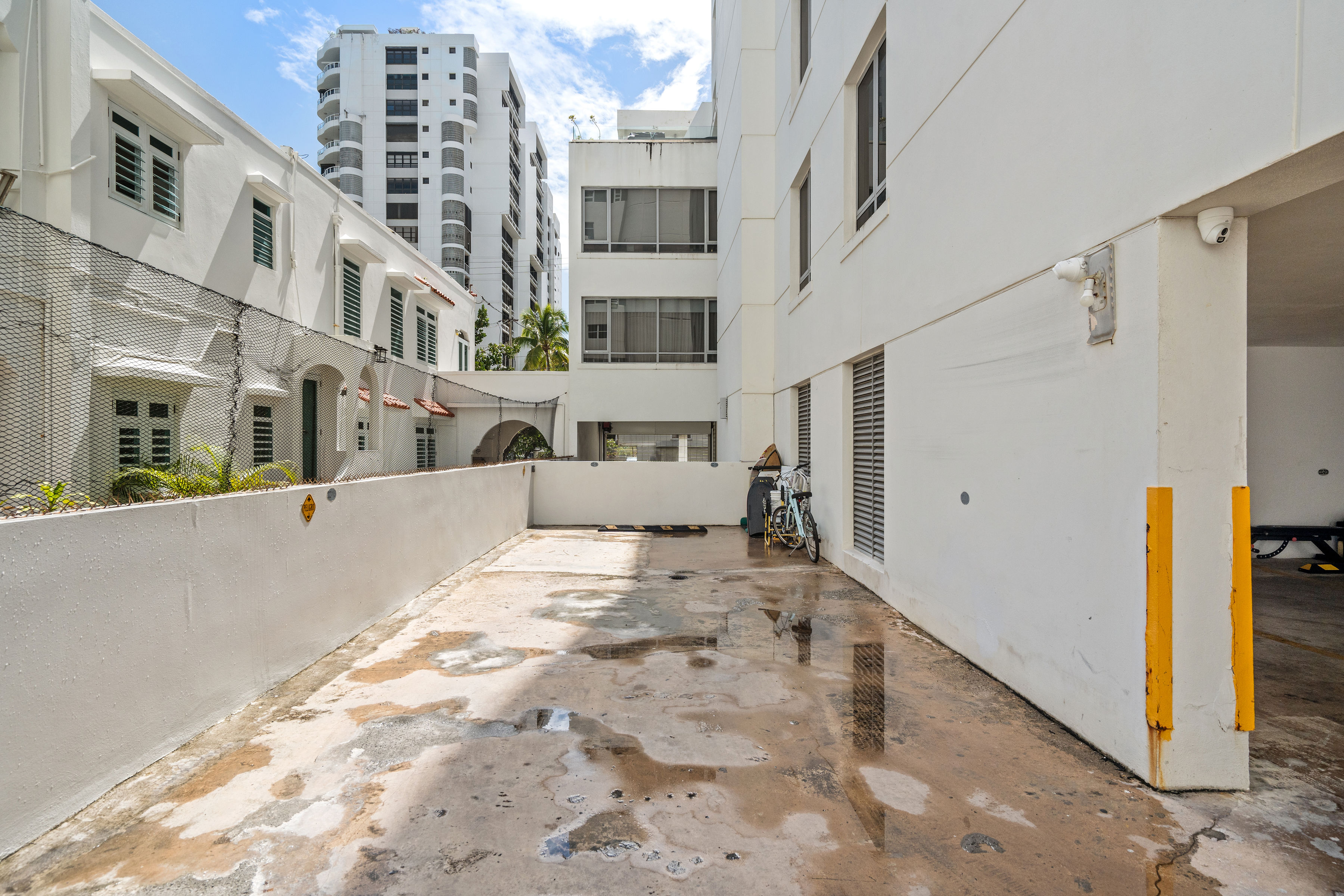 Casa Cervantes 2 | Building parking area with surrounding Condado architecture