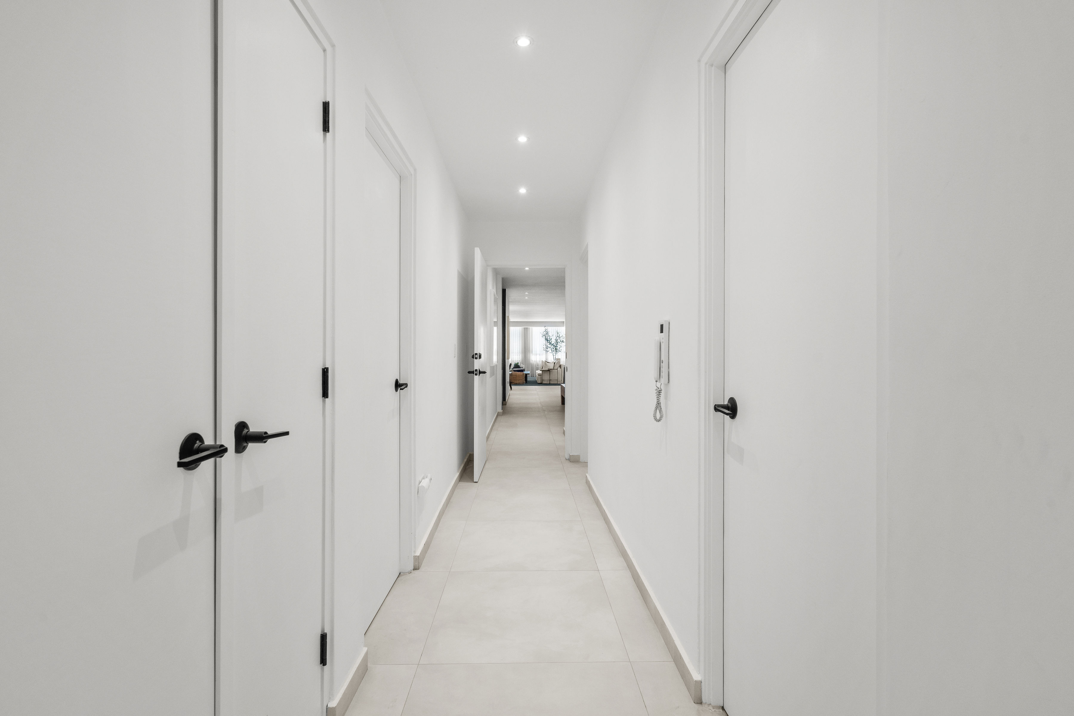 Casa Cervantes 2 | Bright interior hallway connecting the residence's living and private spaces