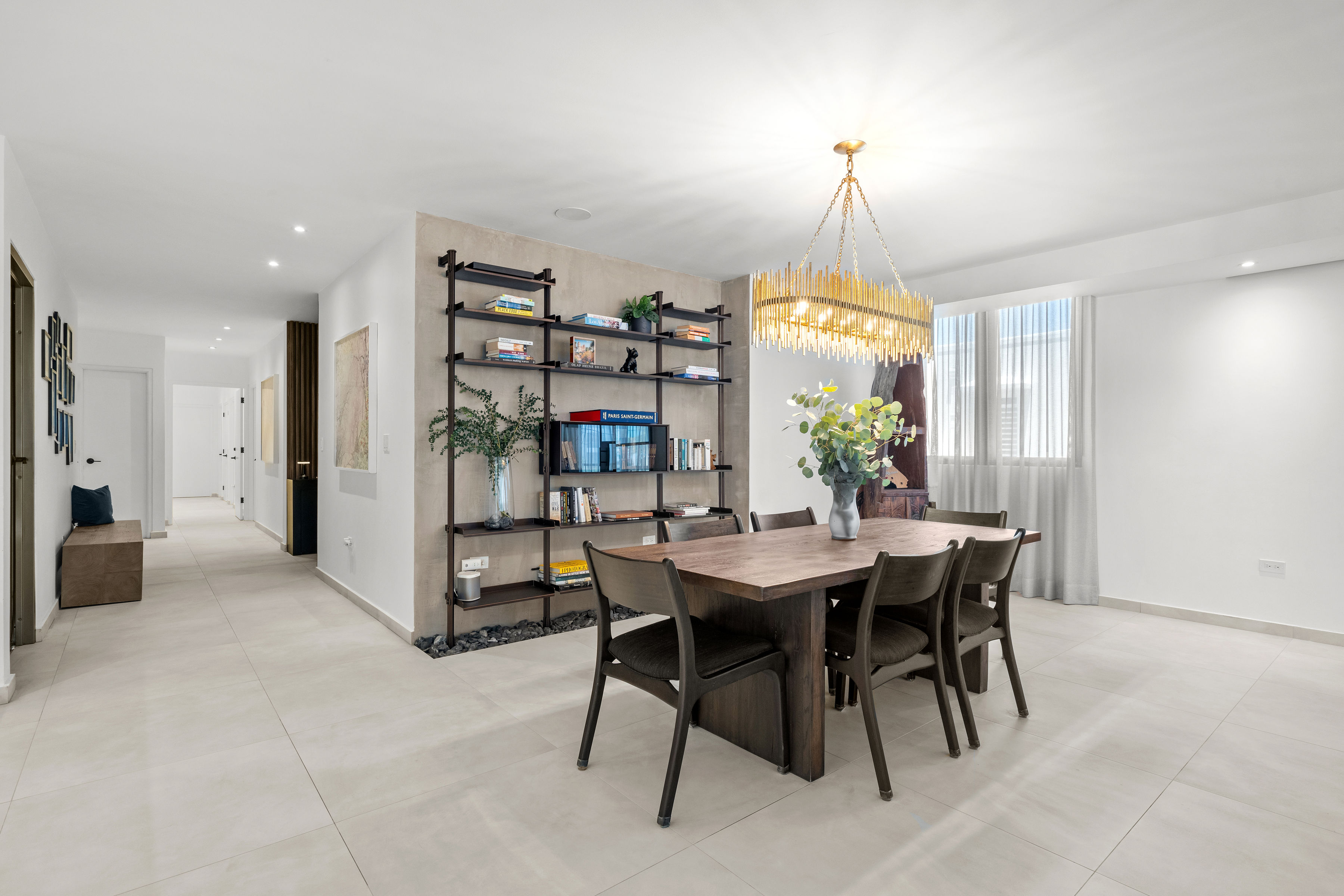 Casa Cervantes 2 | Open dining area with custom shelving, statement lighting, and natural light