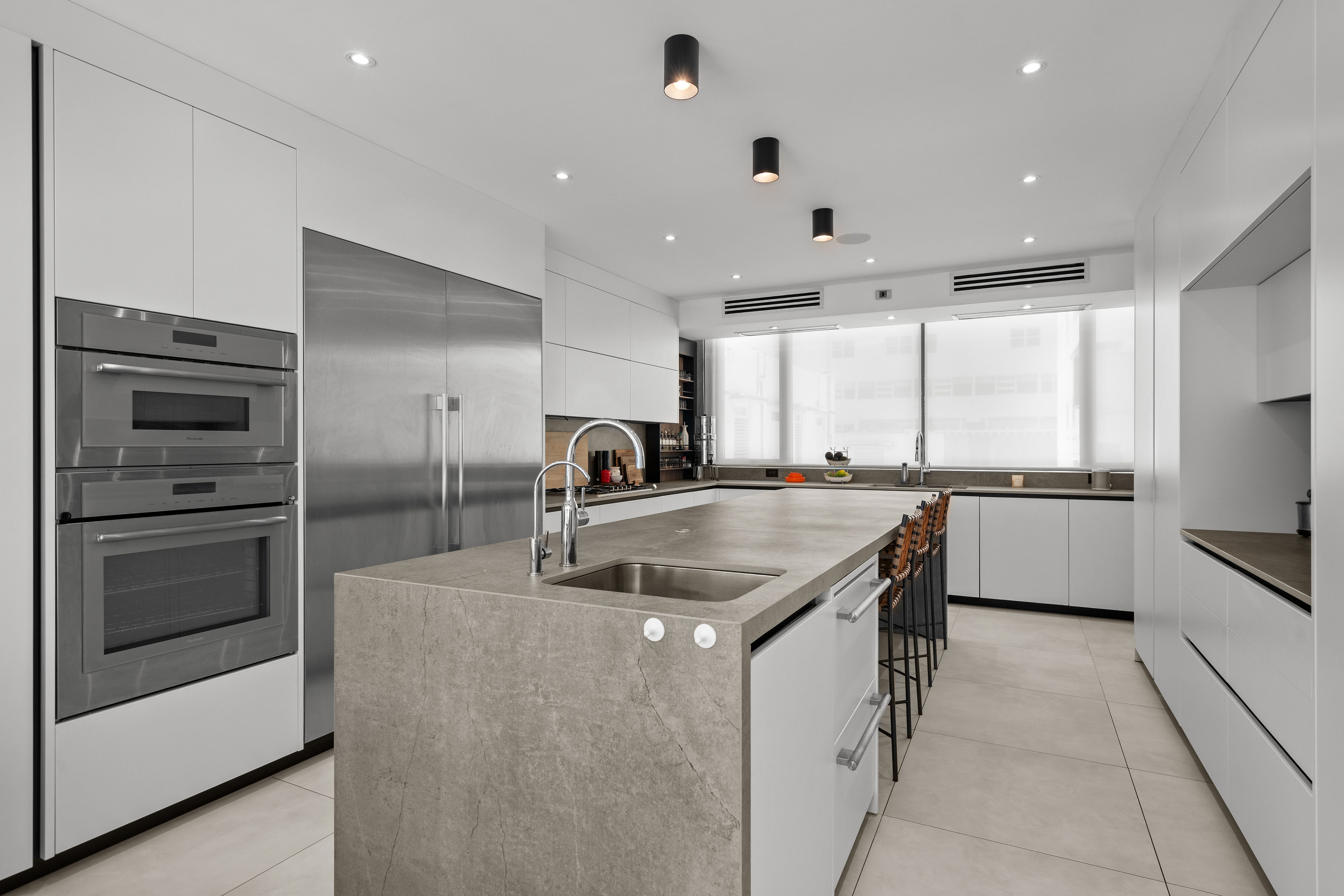Casa Cervantes 2 | Modern kitchen with chef’s prep island, Dekton countertops, and Thermador appliances