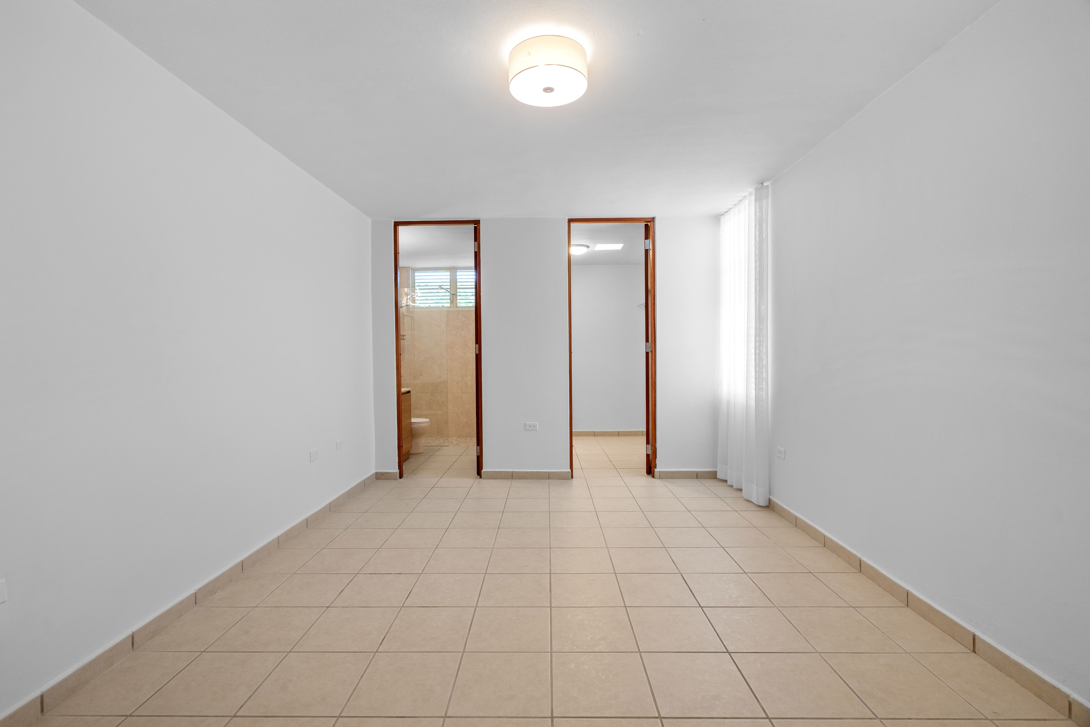 Sabanera Dorado 309 | Unfurnished bedroom with neutral finishes and natural light