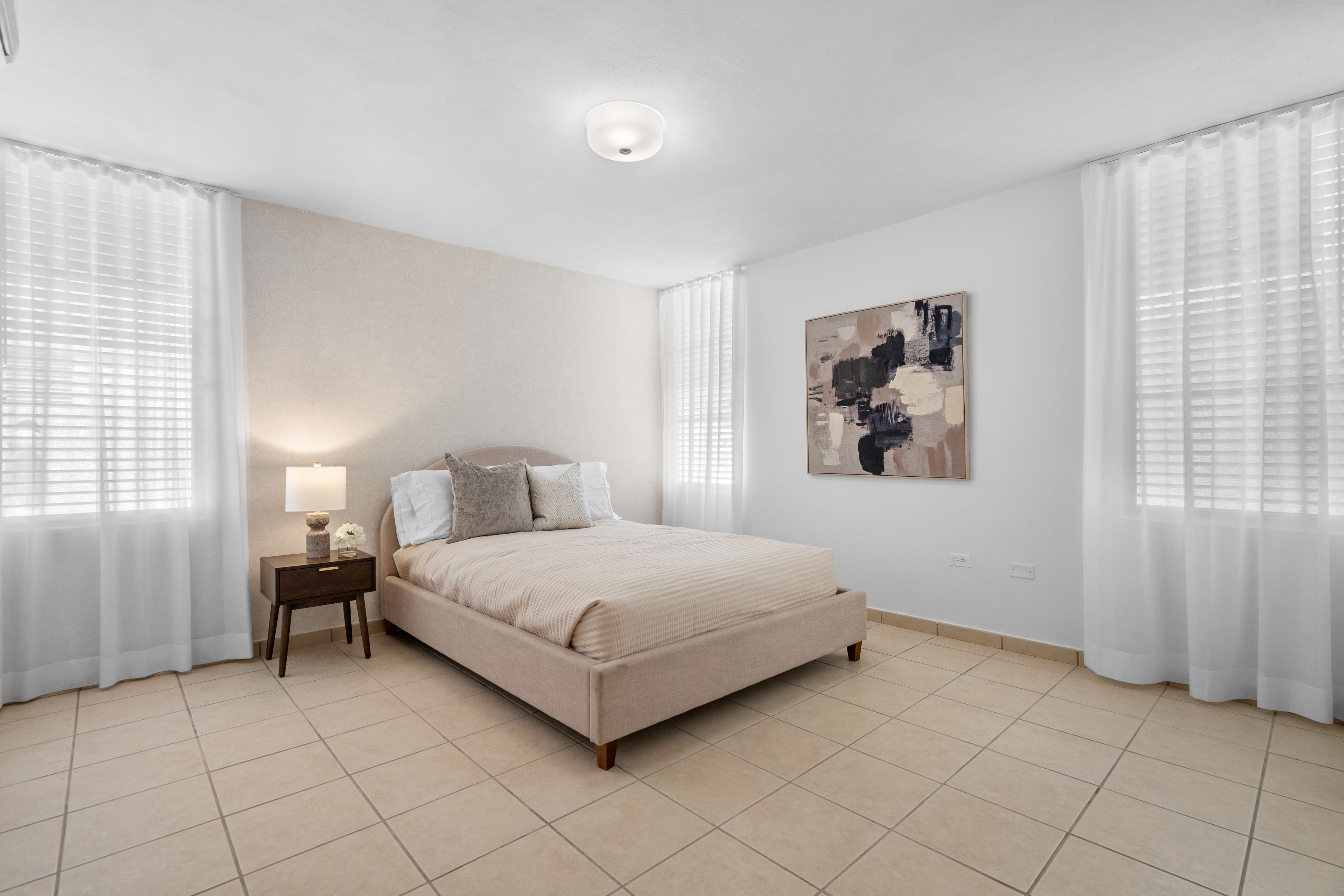 Sabanera Dorado 309 | Furnished bedroom with multiple windows and abundant natural light