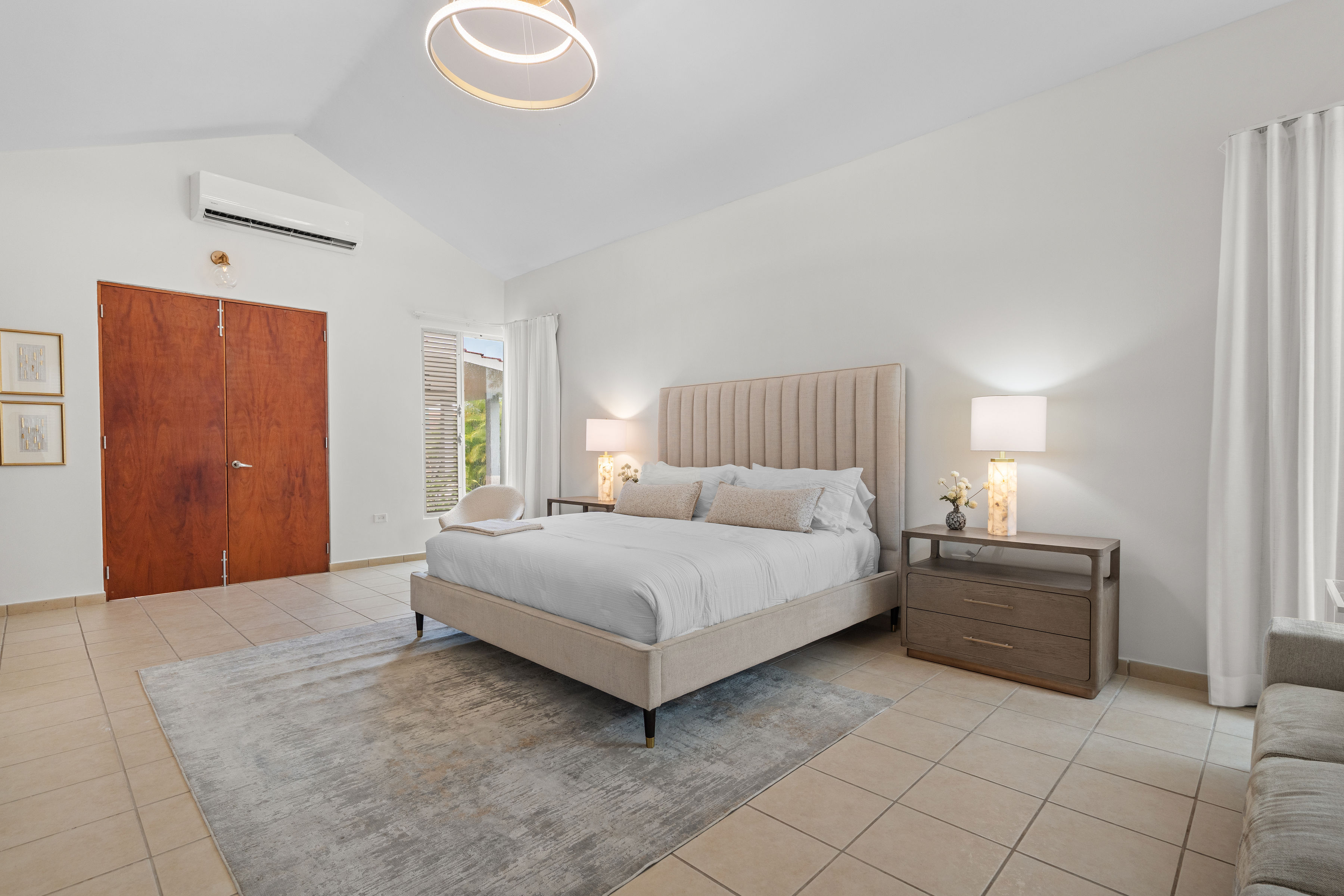 Sabanera Dorado 309 | Primary bedroom with sitting area and windows on multiple sides