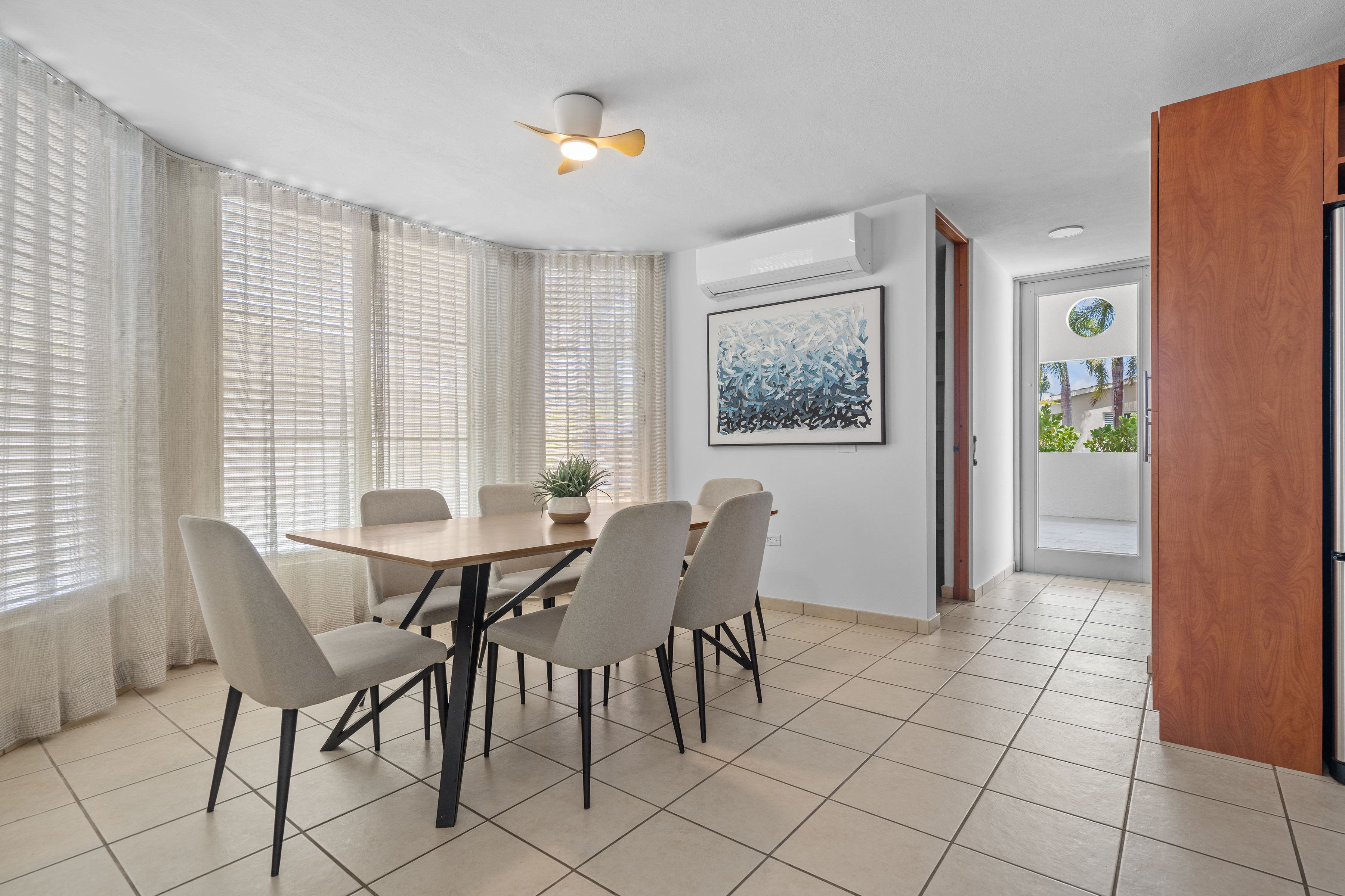 Sabanera Dorado 309 | Bright dining area with large windows and garden views