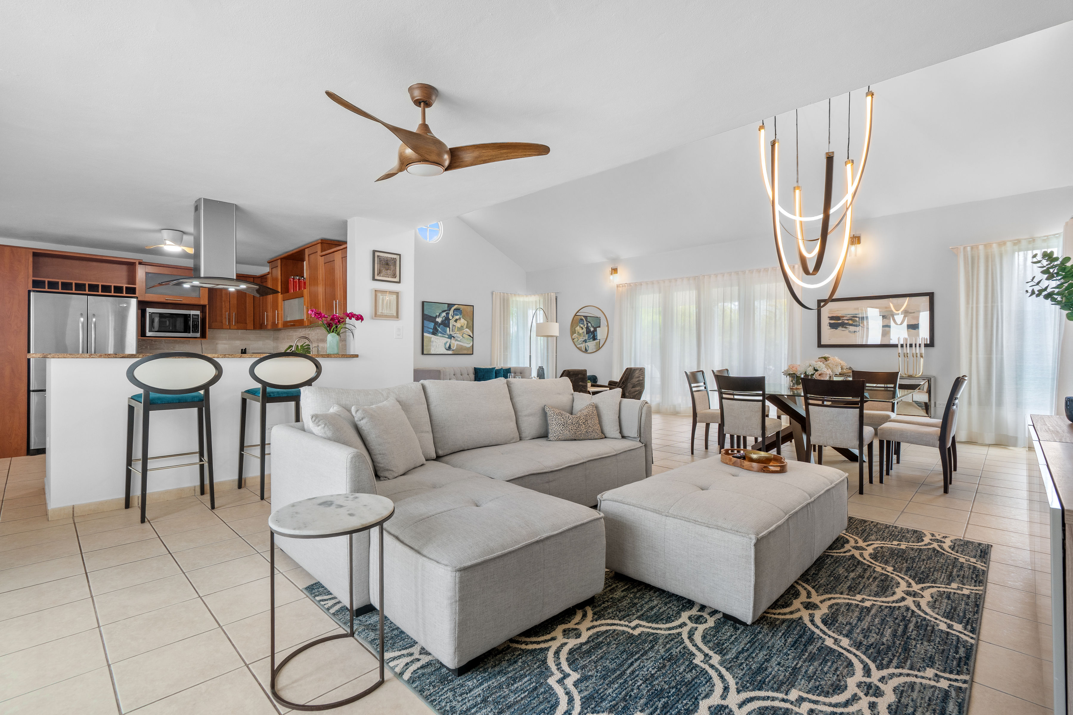 Sabanera Dorado 309 | Open living, dining, and kitchen areas with high ceilings and abundant natural light