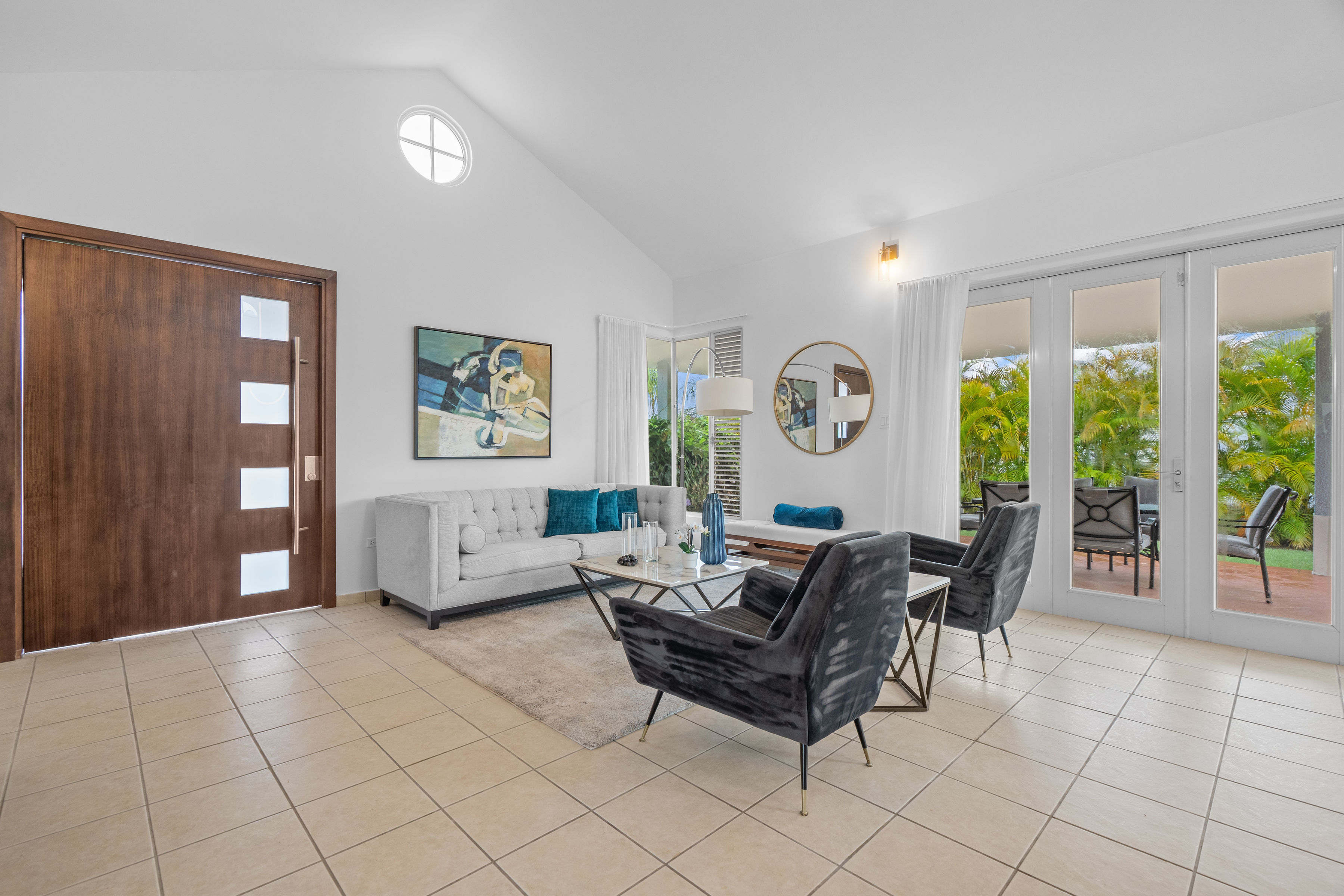 Sabanera Dorado 309 | Open living area with high ceilings, contemporary furnishings, and natural light