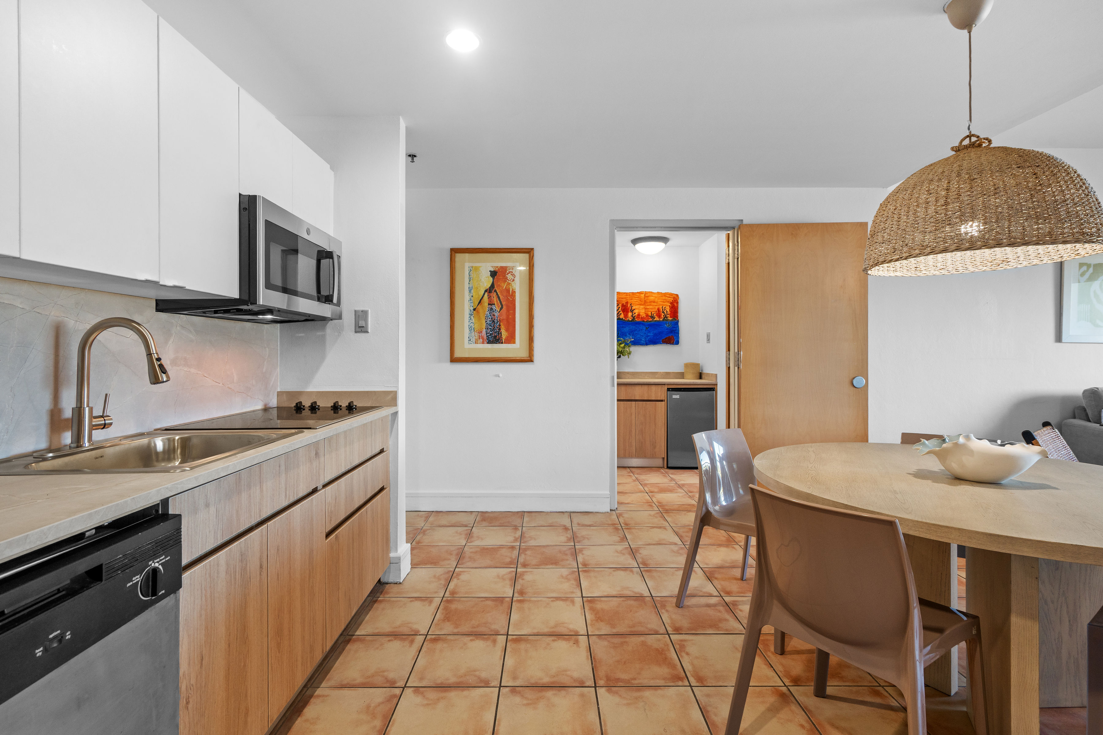 Embassy Villas, Dorado del Mar | Renovated kitchen with breakfast counter opening to the dining and living areas