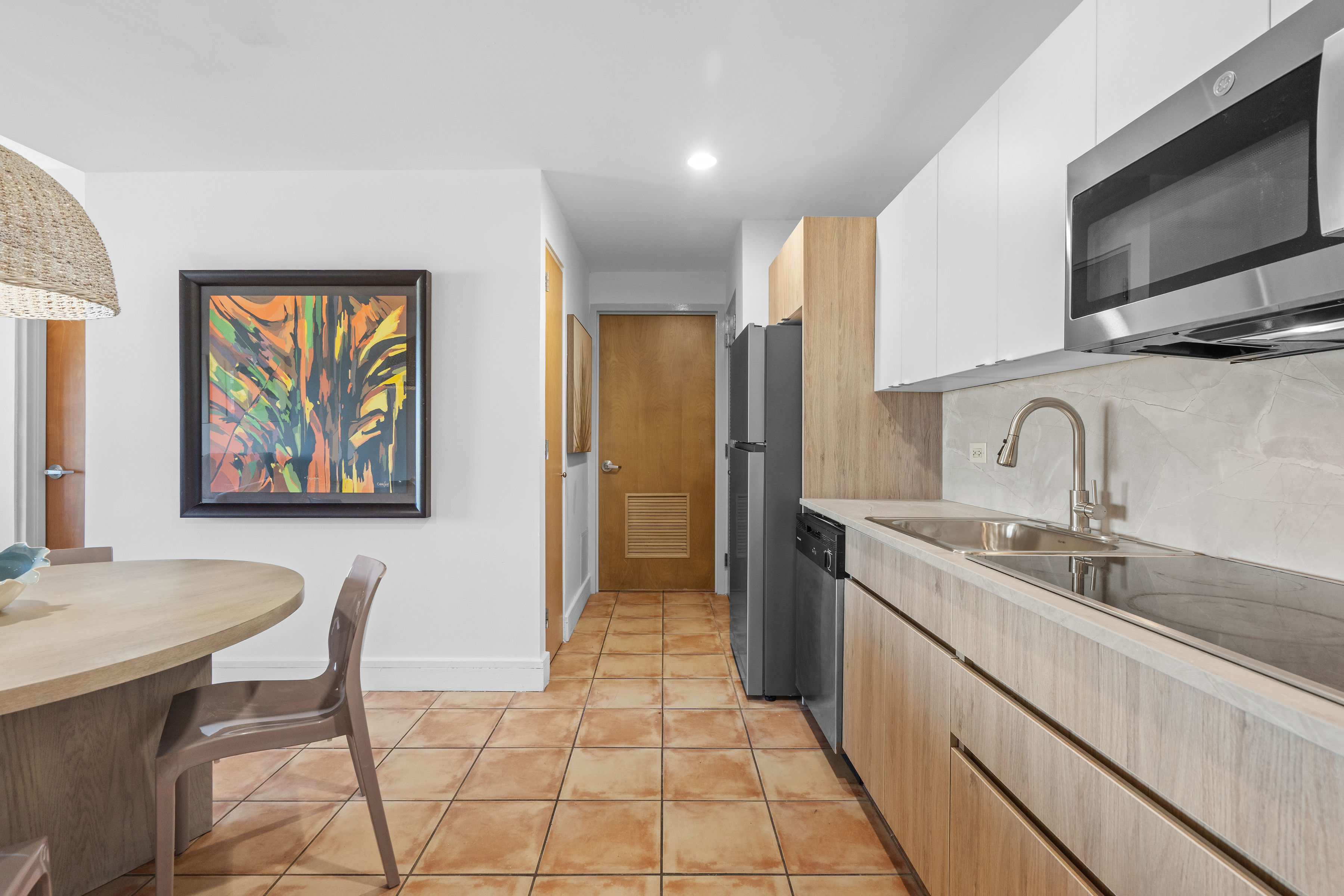 Embassy Villas, Dorado del Mar | Renovated kitchen with modern cabinetry, countertops, and stainless steel appliances