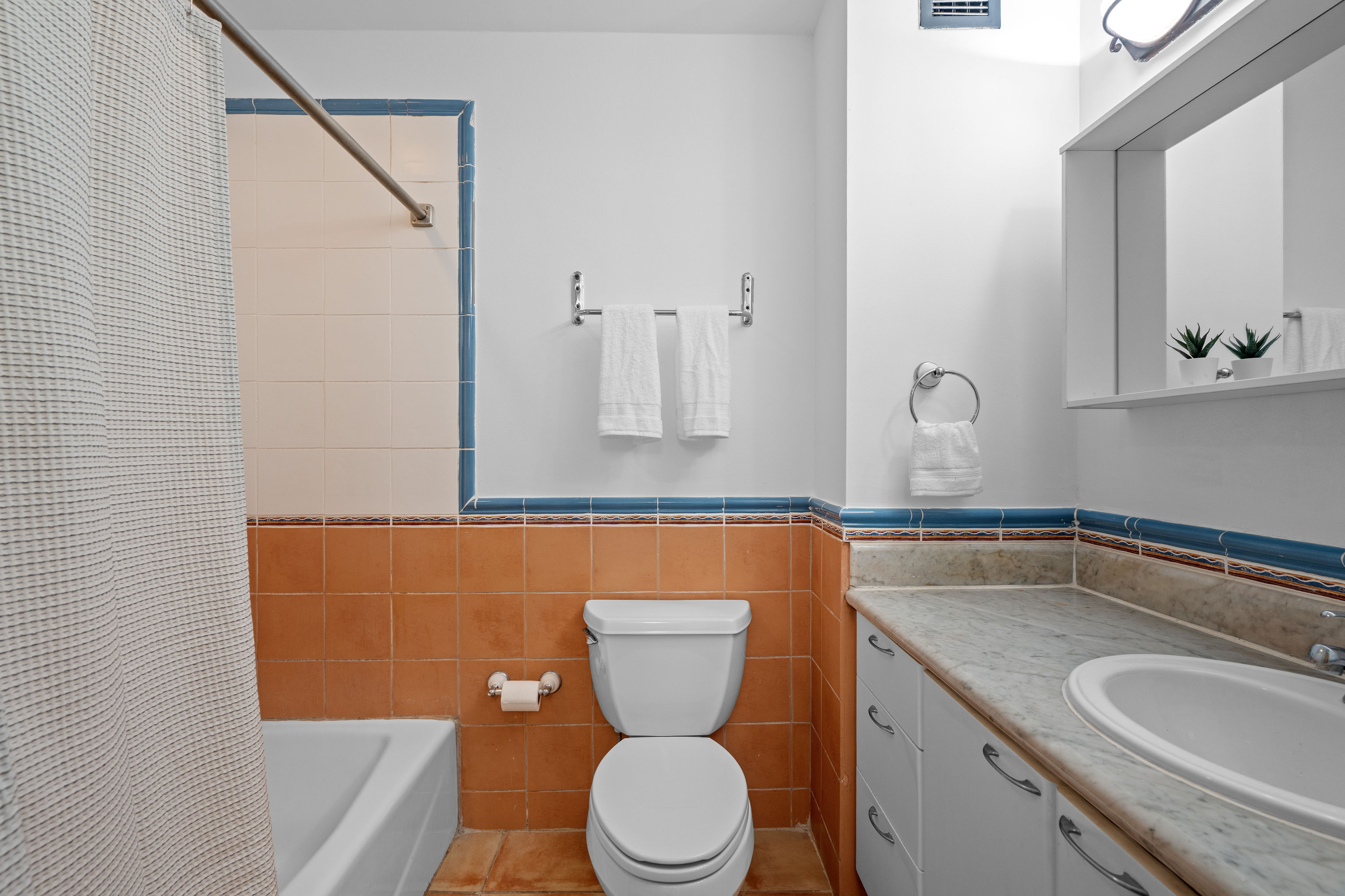 Embassy Villas, Dorado del Mar | Guest bathroom with shower, vanity, and tiled finishes
