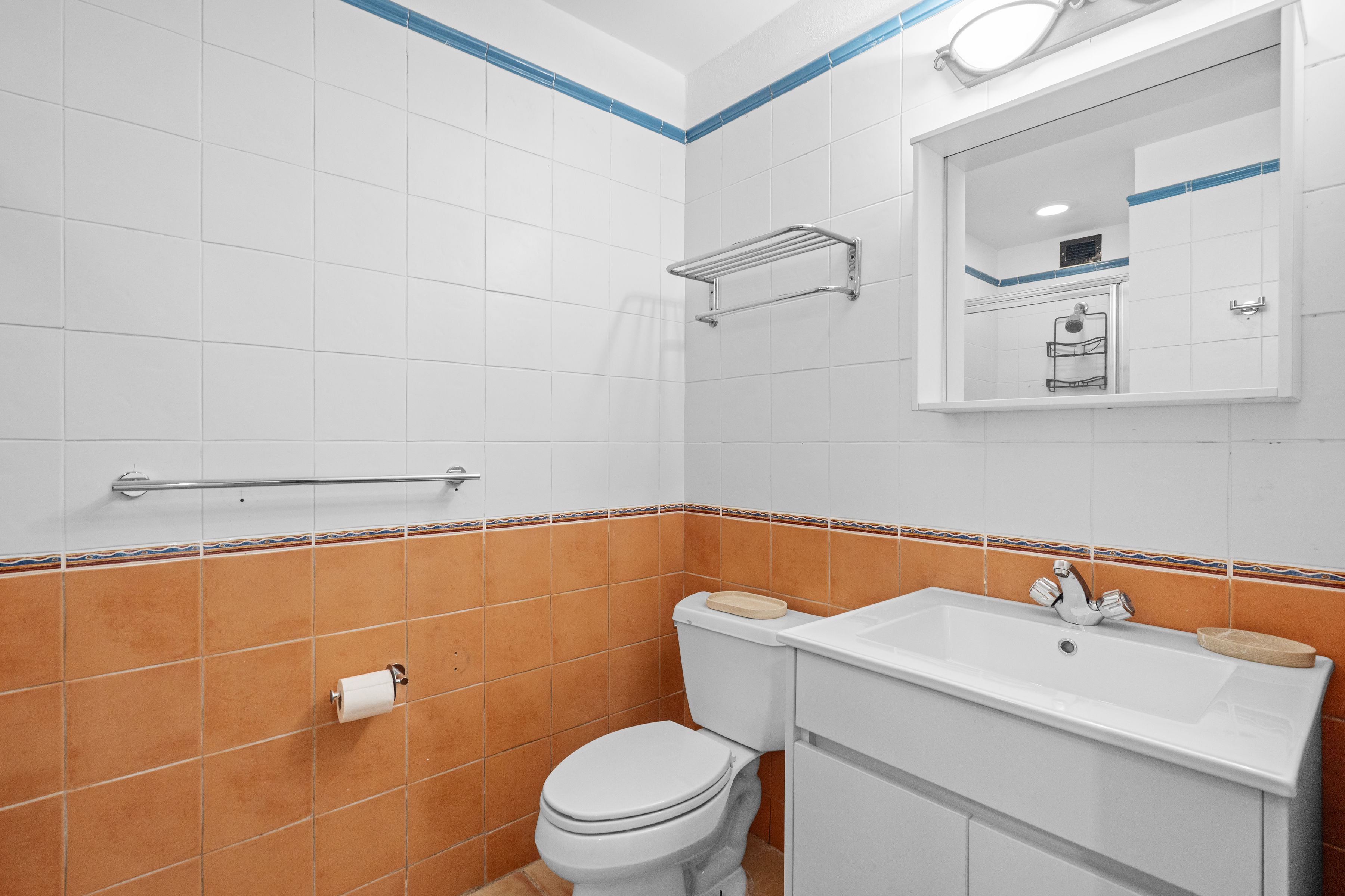 Embassy Villas, Dorado del Mar | Primary bathroom with vanity, toilet, and tiled finishes
