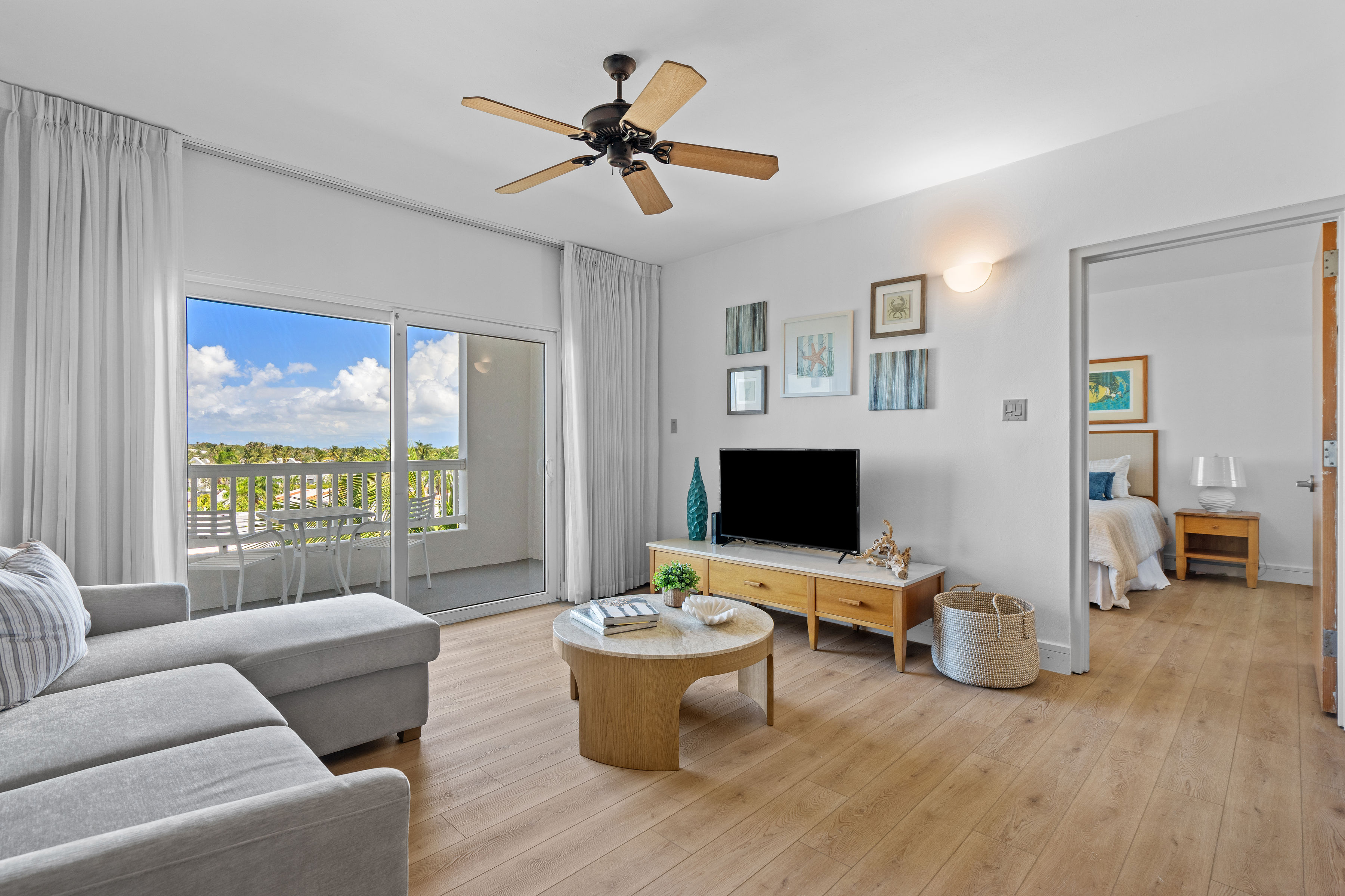 Embassy Villas, Dorado del Mar | Furnished living room with natural light and open connection to the dining area