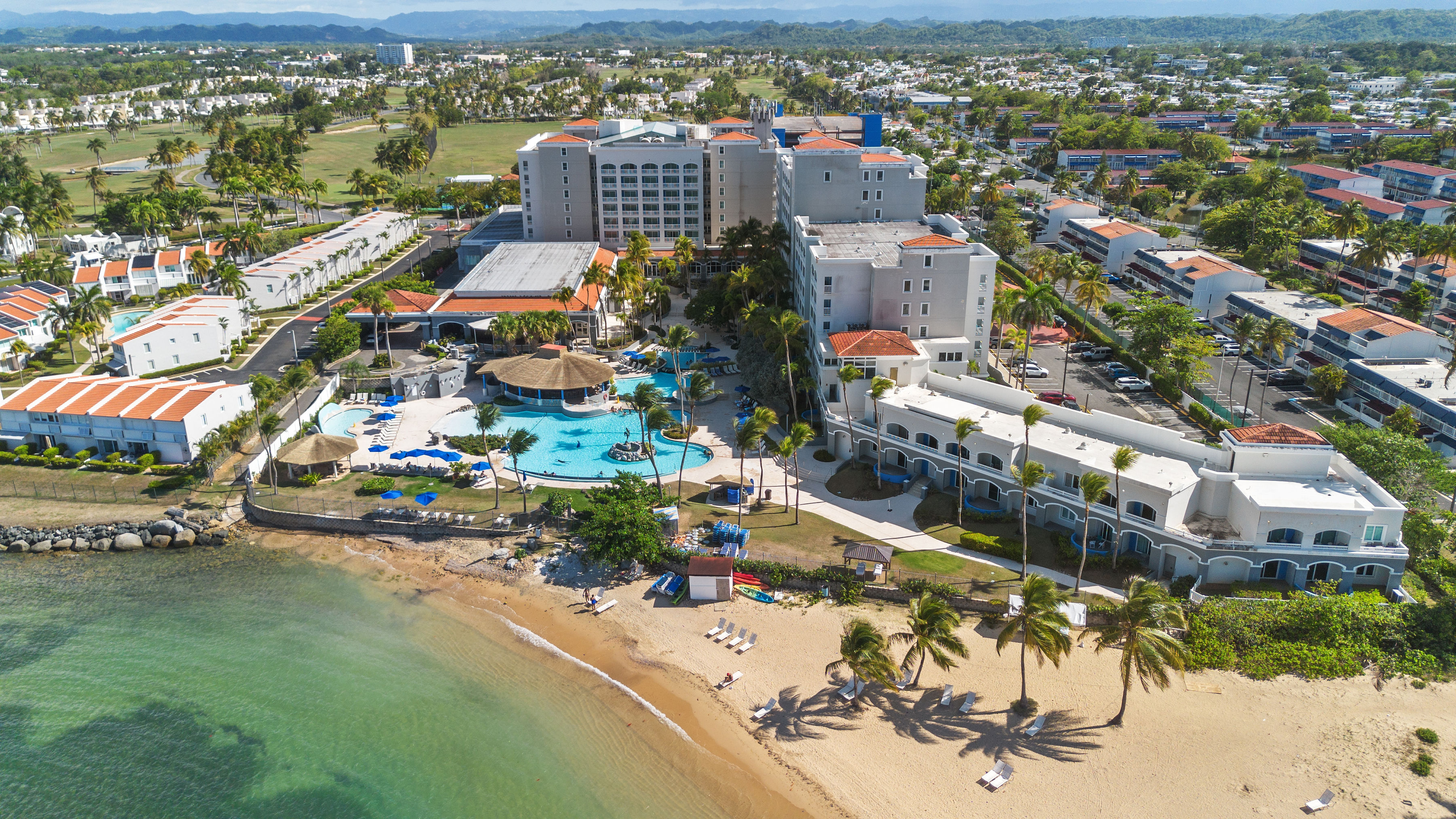 Embassy Villas, Dorado del Mar | Aerial view of Embassy Suites resort, pools, beach, and Atlantic coastline
