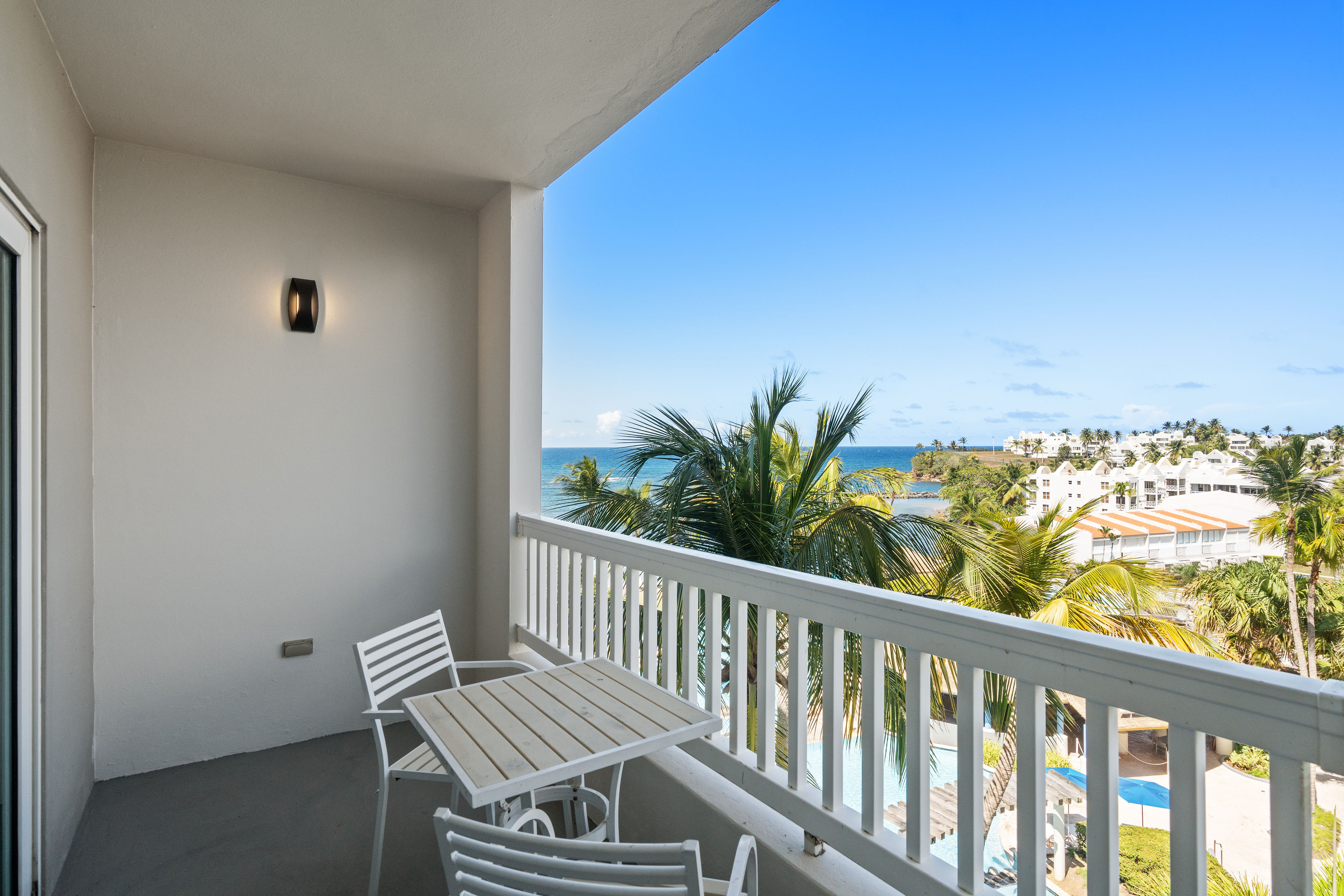 Embassy Villas, Dorado del Mar | Covered balcony with seating and views across Dorado del Mar
