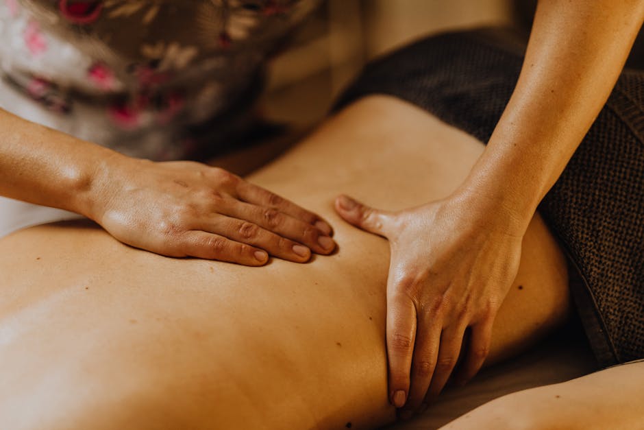 therapist hands performing flowing massage strokes - mind body flow massage