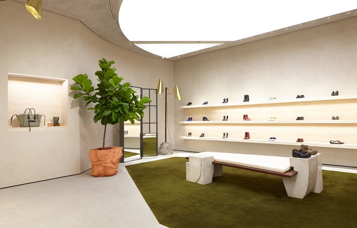 Minimal retail interior design using soft neutral tones inspired by Pantone Cloud Dancer 2026