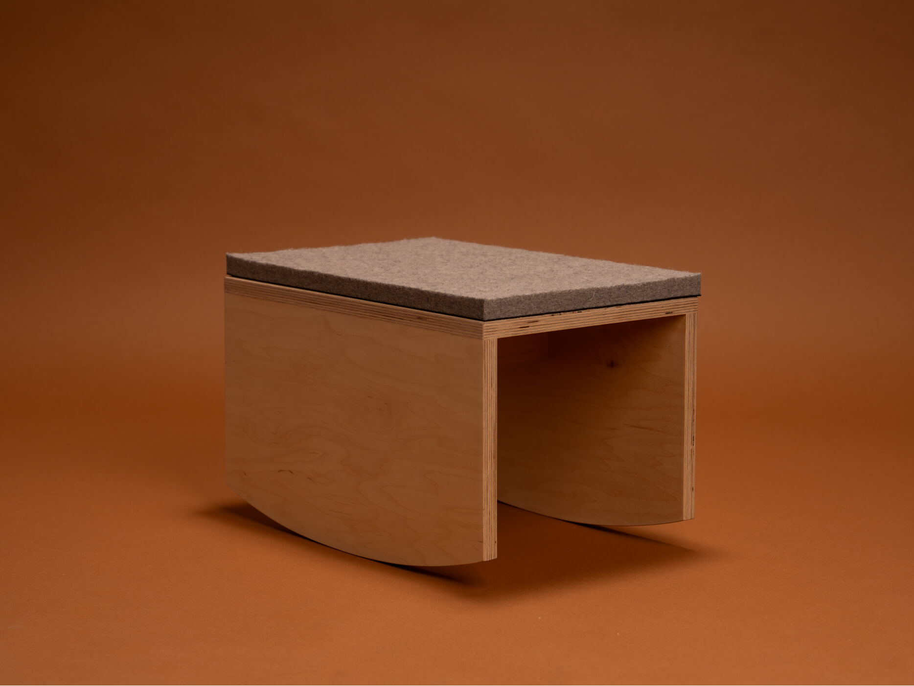 The mmoa rocker featured on a seamless brown background.