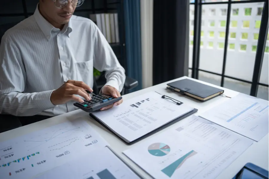 CPA at Dimov Audit compiling a comprehensive financial statement audit for a franchise operation