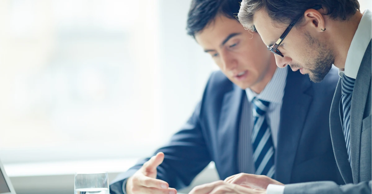 Business professionals analyzing government audit and compliance services documentation for regulatory requirements