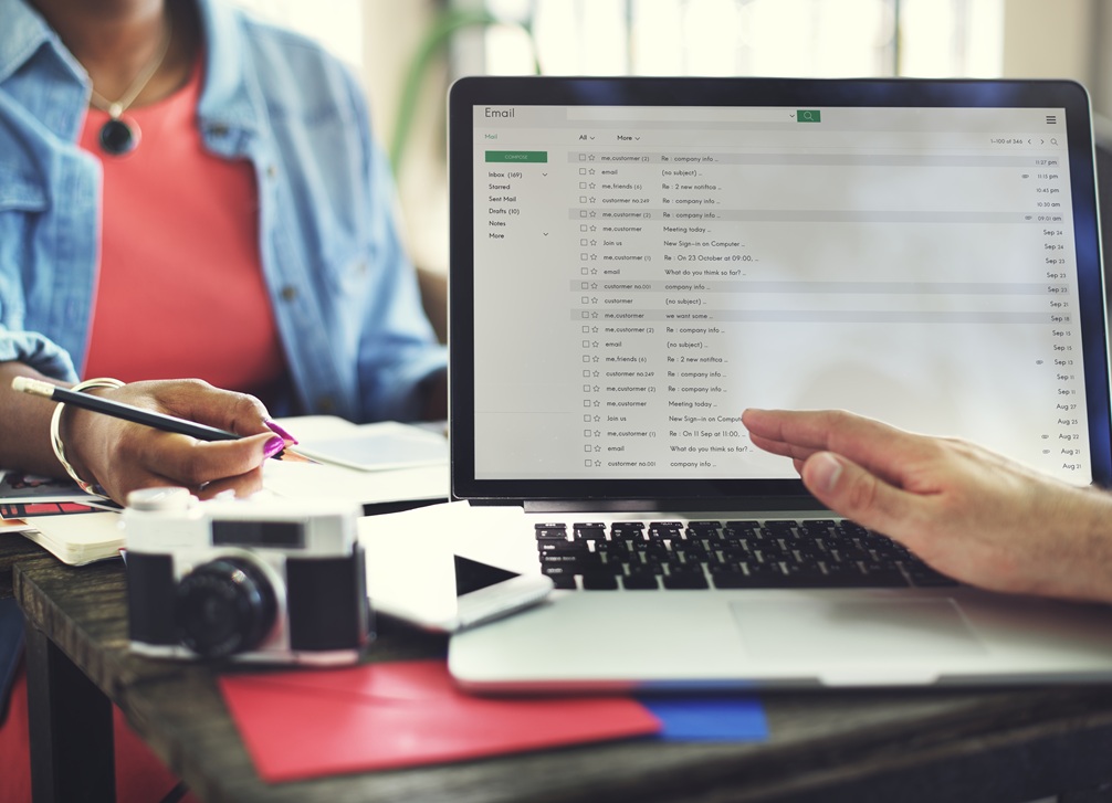 melissa and client happily discussing the client's needs on a couch