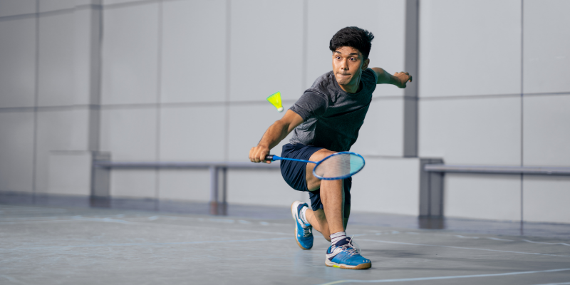 Badminton player having fun at the courts thanks to Bizcap Line of Credit Loan