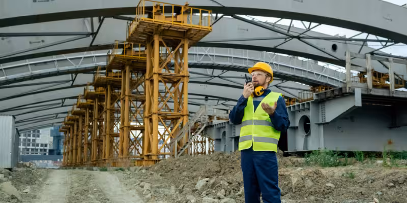 Civil infrastructure company business owner wearing high vis while working at construction site