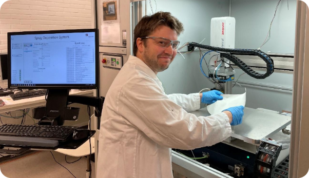 A person wearing a white coat and glovesAI-generated content may be incorrect.