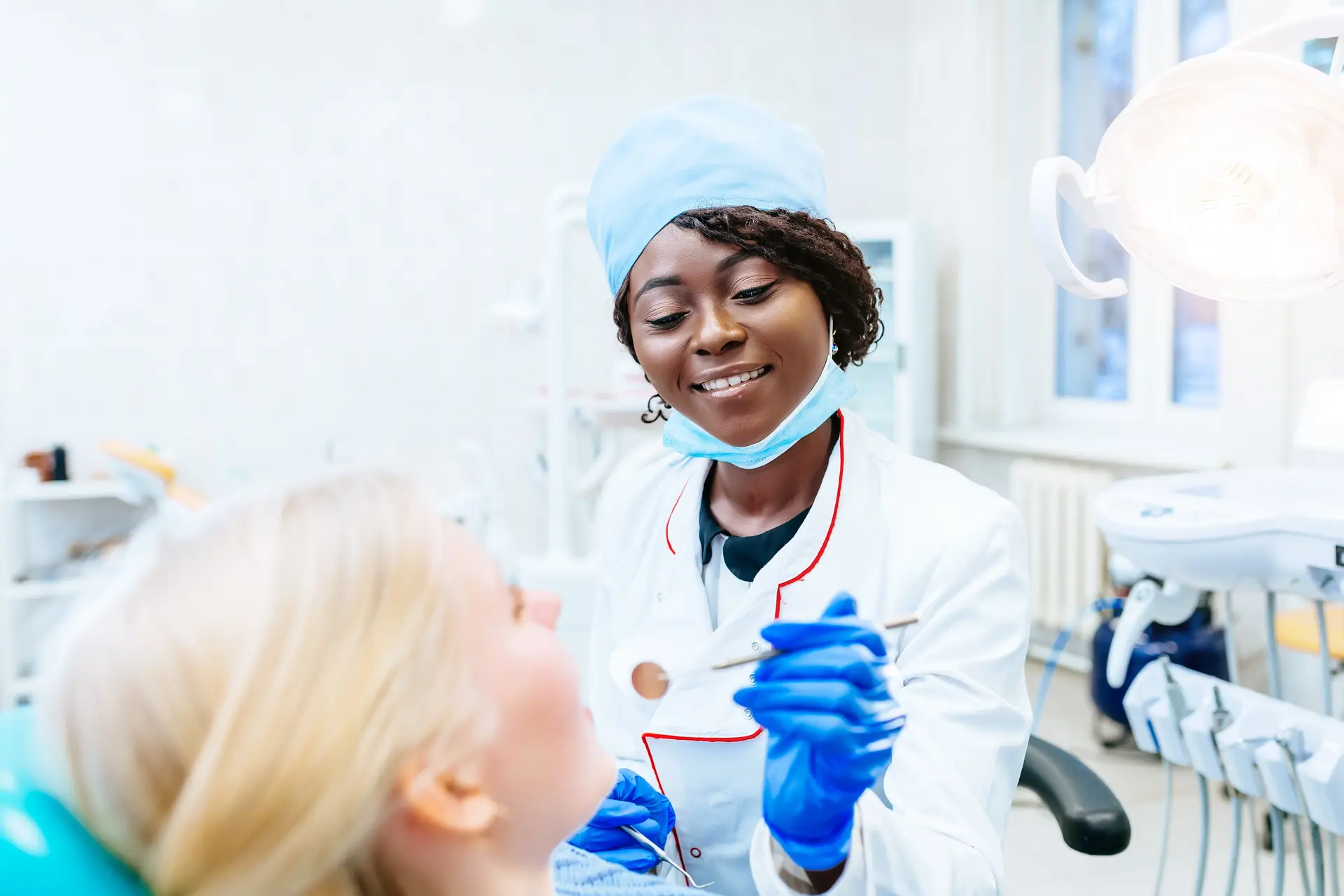 Dentist examining a patient’s teeth – example of a limited purpose FSA eligible dental expense.