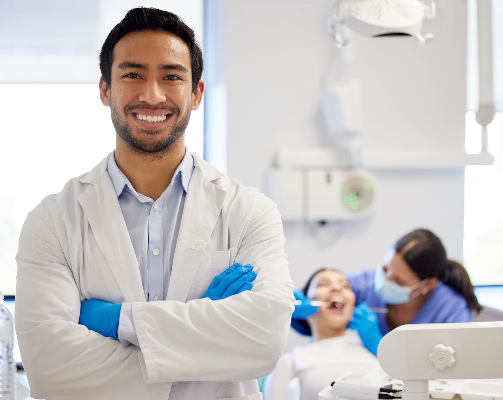 A dentist in a modern clinic discusses periodontal treatment with a patient while highlighting the differences between D4341 and D4342 dental codes.