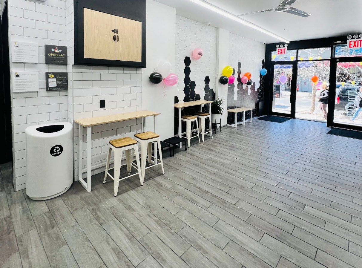 Bright front seating area by the entrance at LaundryBee Bushwick