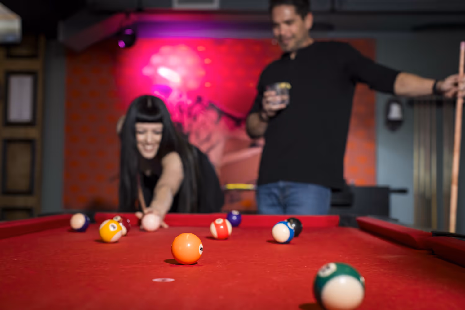 couple playing pool